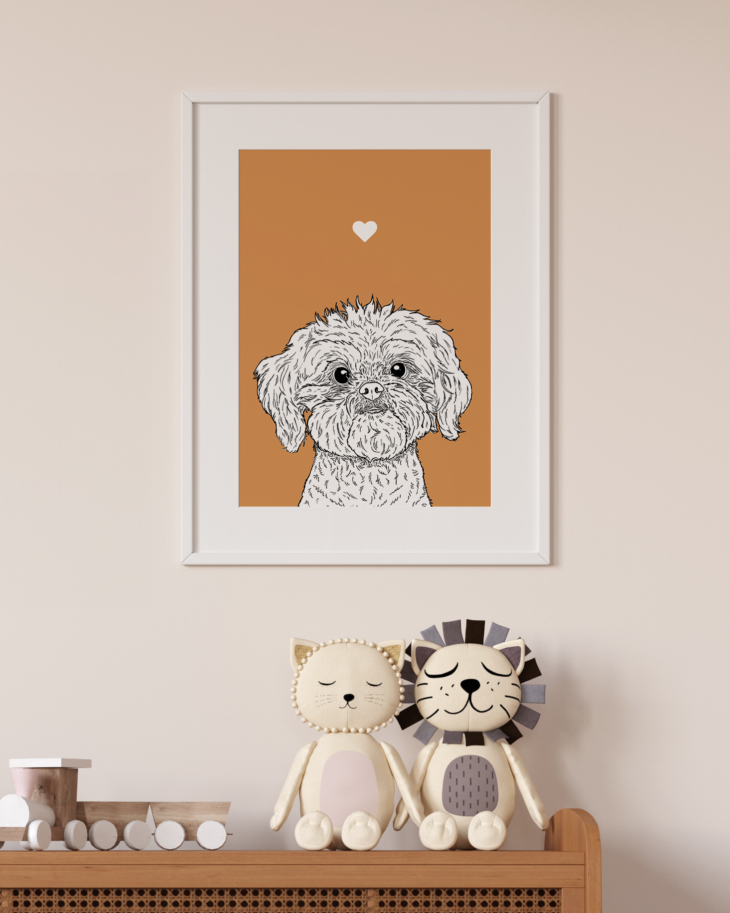 An A4 print in a white frame on a wall above 2 lion toys sitting on a unit. It has a black & white illustration of the head & shoulders of a Shih Tzu dog on an orange background.