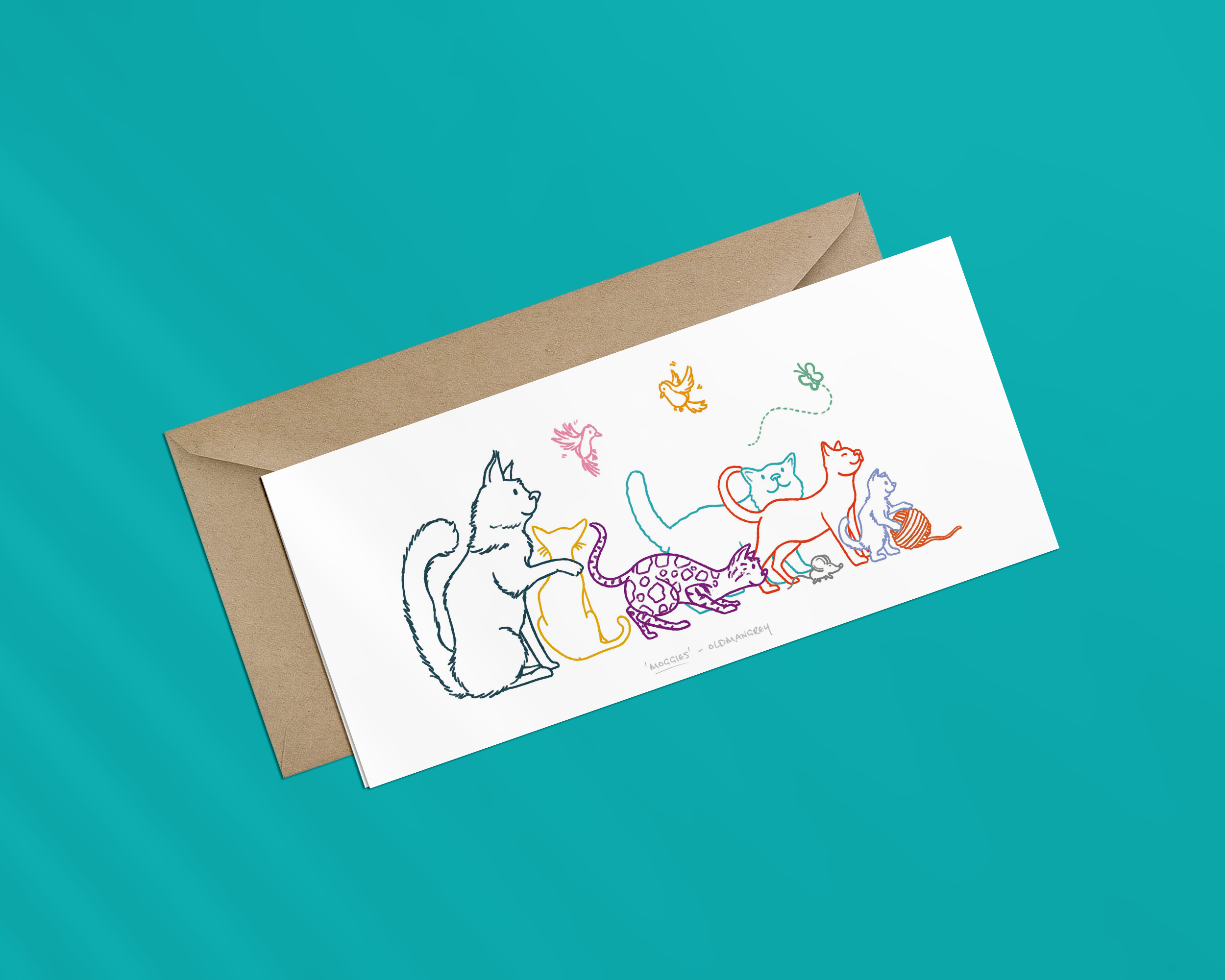 A landscape greetings card on a brown envelope, with a colourful digital illustration of 6 cats, 2 birds, a butterfly & mouse. The image has a bright blue background.