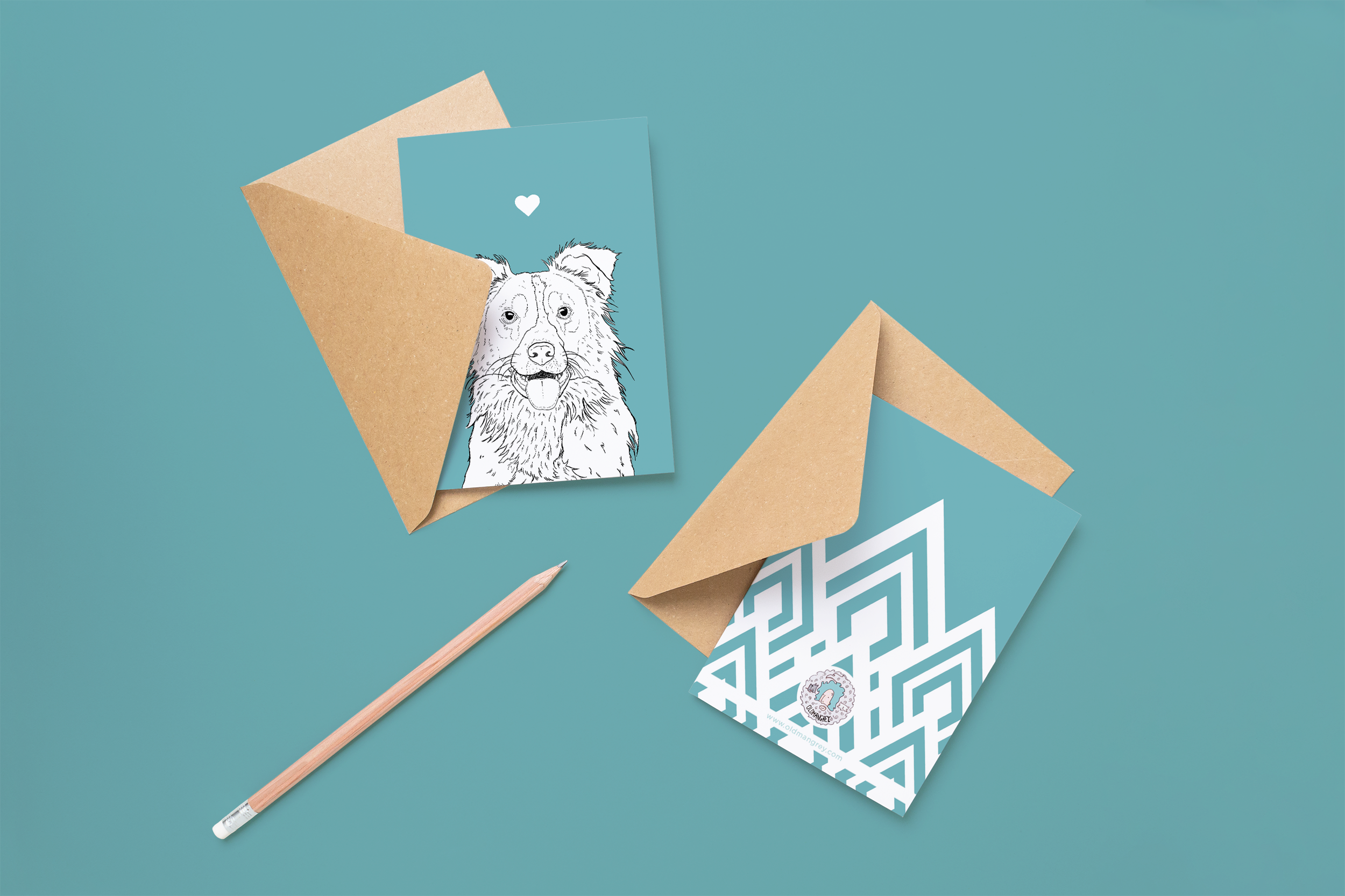 Two cards on brown envelopes, one face up one down. The card and image have a pale blue coloured background, with a black & white digital illustration of the head & shoulders of a Border Collie dog.