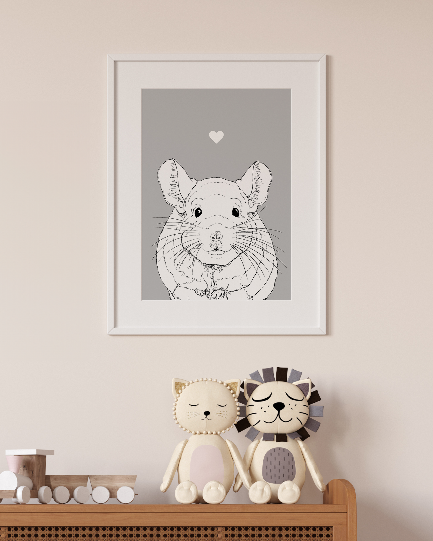 An A4 print in a white frame on a wall above 2 lion toys sitting on a unit. It has a black & white illustration of a Chinchilla on a grey background.