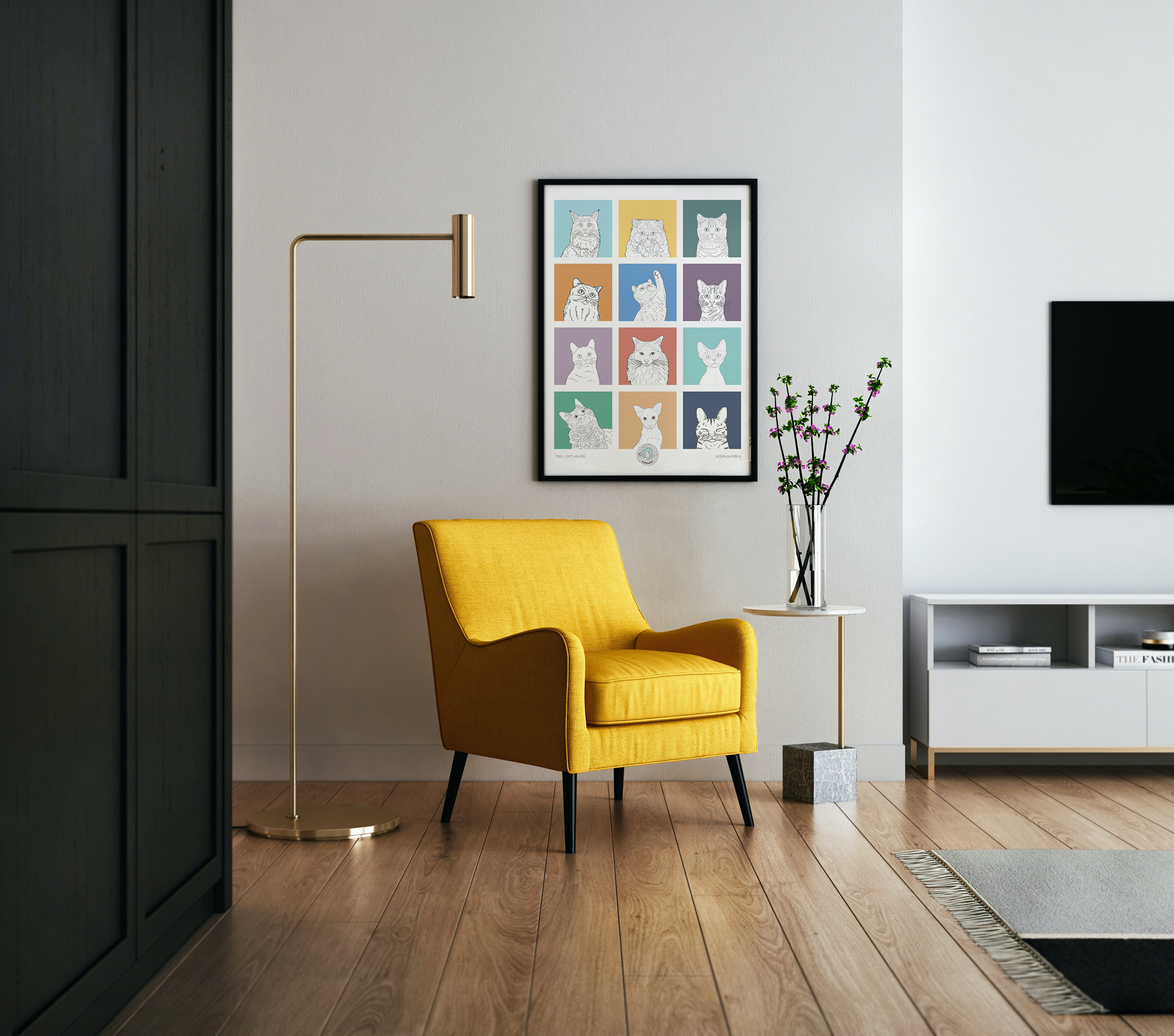An A3 print with a 3 by 3 grid of bright squares with a black & white digital illustration of the head & shoulders of a cat. Hung above a yellow armchair.