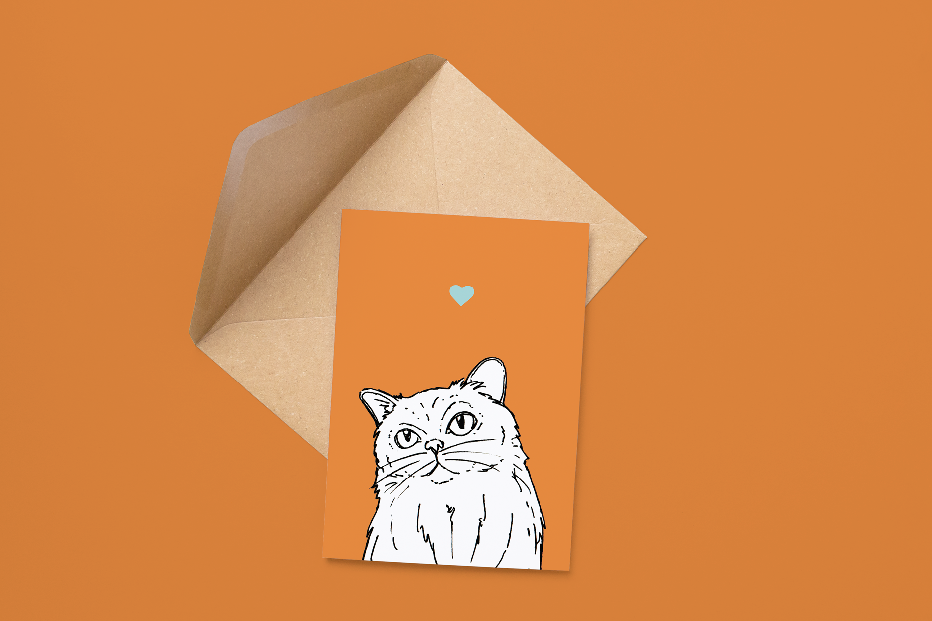 An A6 greetings card on a brown envelope. The card & image have an orange background, with a black & white digital illustration of the head & shoulders of a fluffy cat.