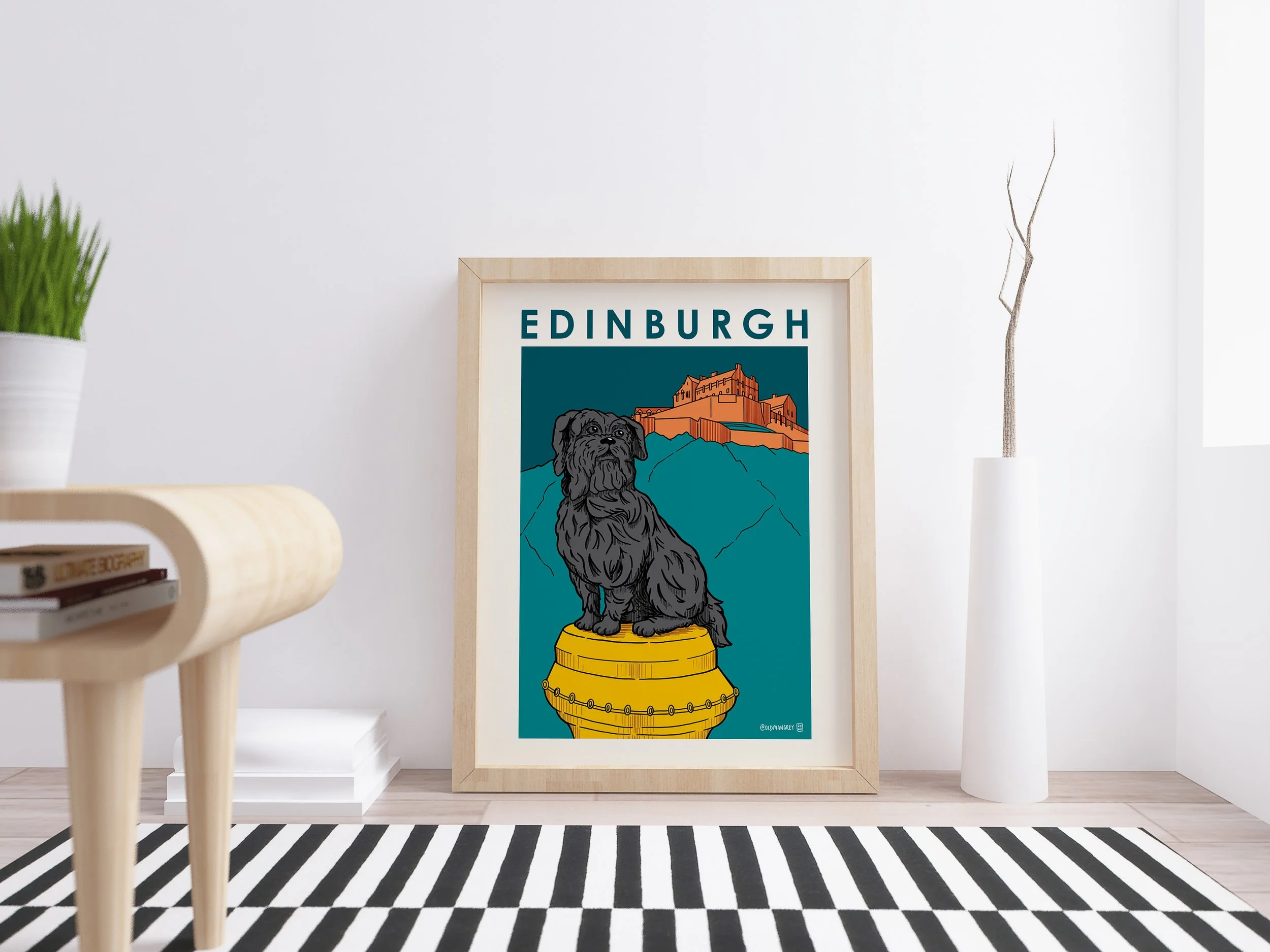 A4 digital illustration of Greyfriars Bobby set against an Edinburgh Castle backdrop. Framed leaning against a wall with a striped rug in front.