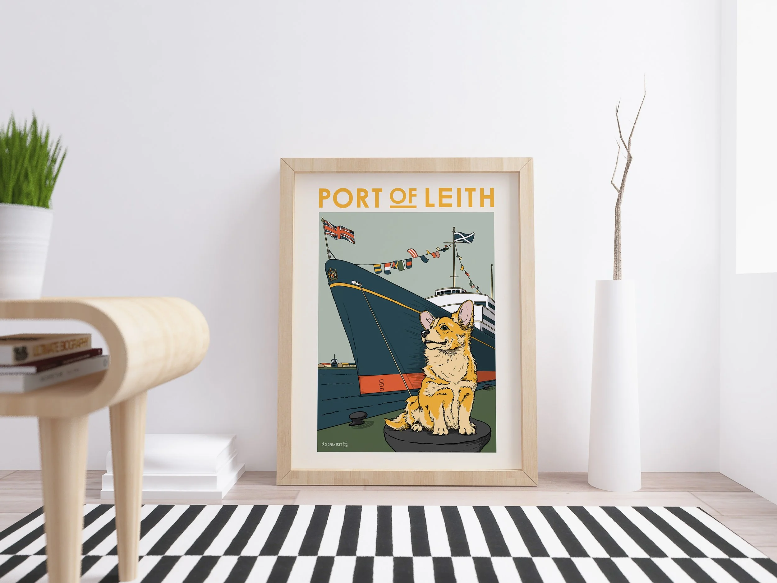A4 digital illustration of Corgi set against the Royal Yacht Britannia. Framed leaning against a wall with a striped rug in front.