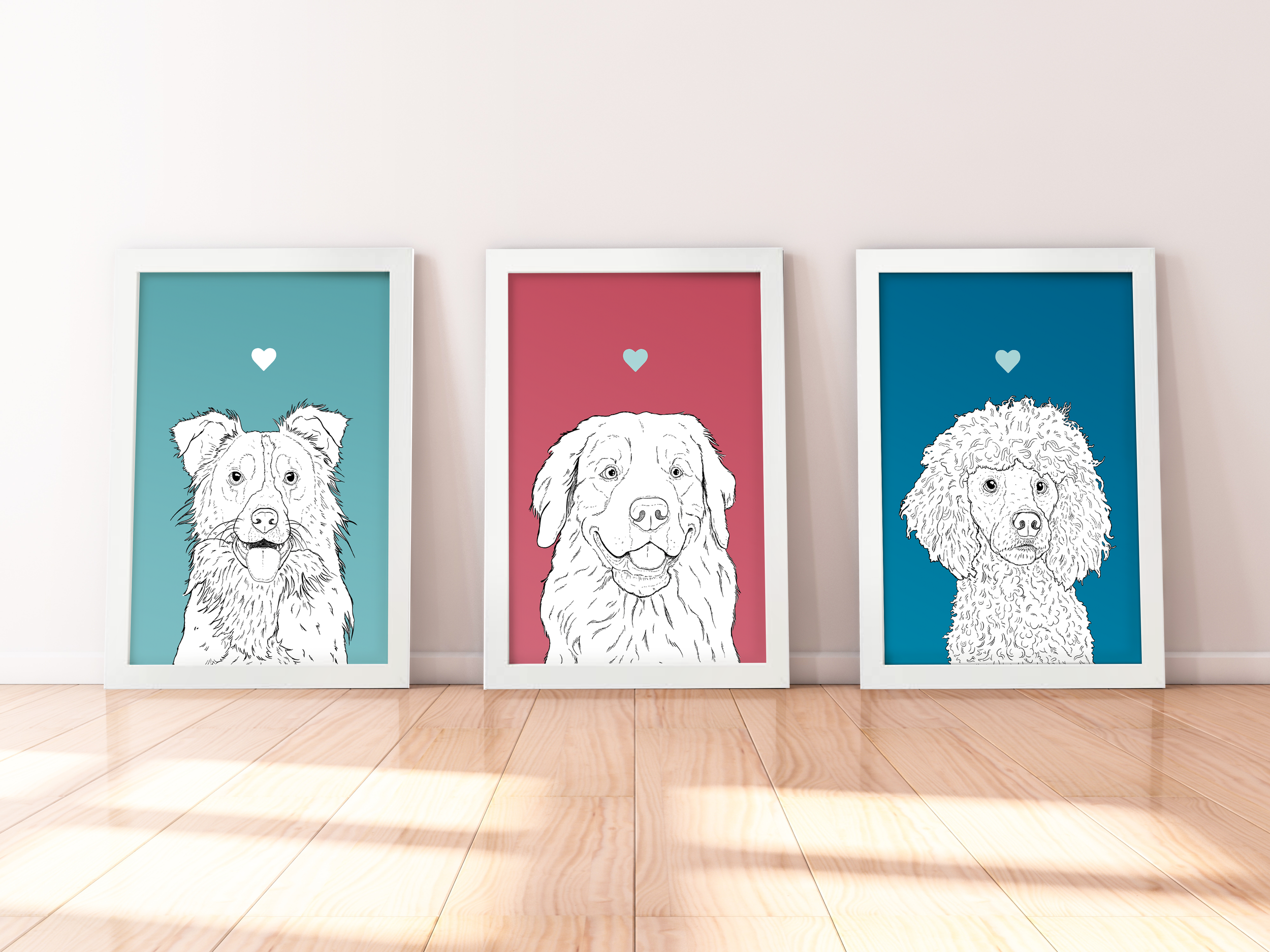 A trio of A4 prints in white wooden frames leaning against a white wall. Each has a black & white digital illustration of the head & shoulders of a different dog breed: Collie, Retriever, Poodle.