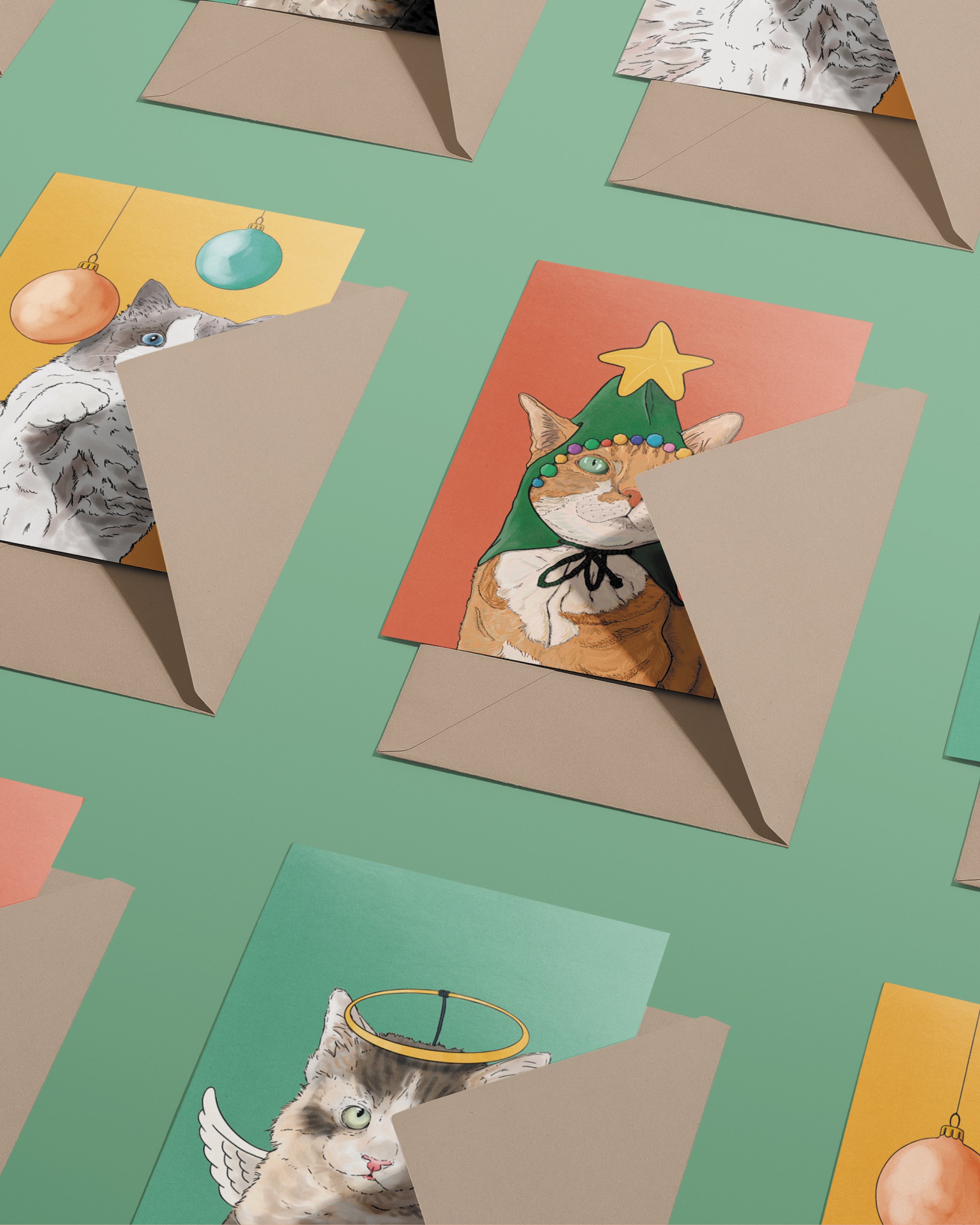 3 x A6 Cat Christmas Cards, bright digital illustrations including a ginger cat in a green Christmas tree hat! Copies tucked into brown envelopes, set on a flat turquoise background.