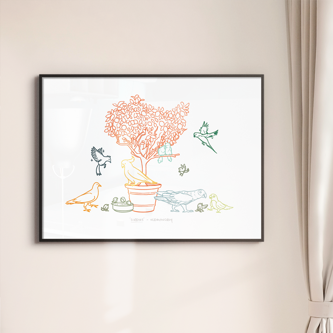 An A3 print in a thin dark frame on a white wall with soft light. The print has a colourful digital illustration of birds on & around a small tree.
