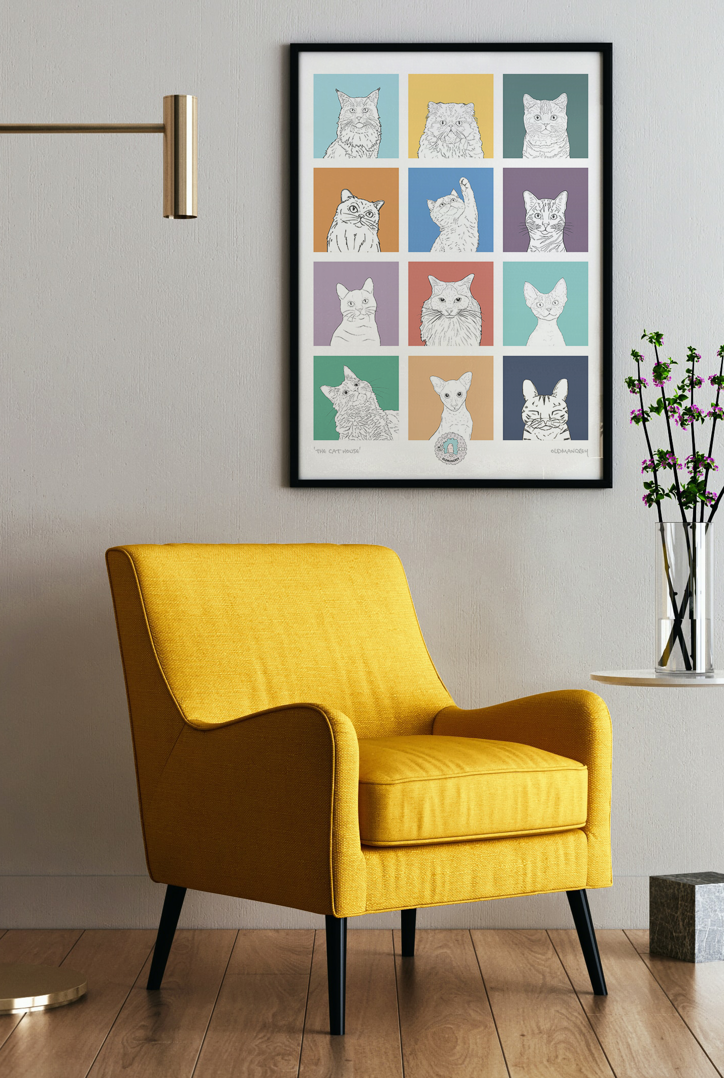 An A3 print with a 3 by 3 grid of bright squares with a black & white digital illustration of the head & shoulders of a cat. Hung above a yellow armchair.