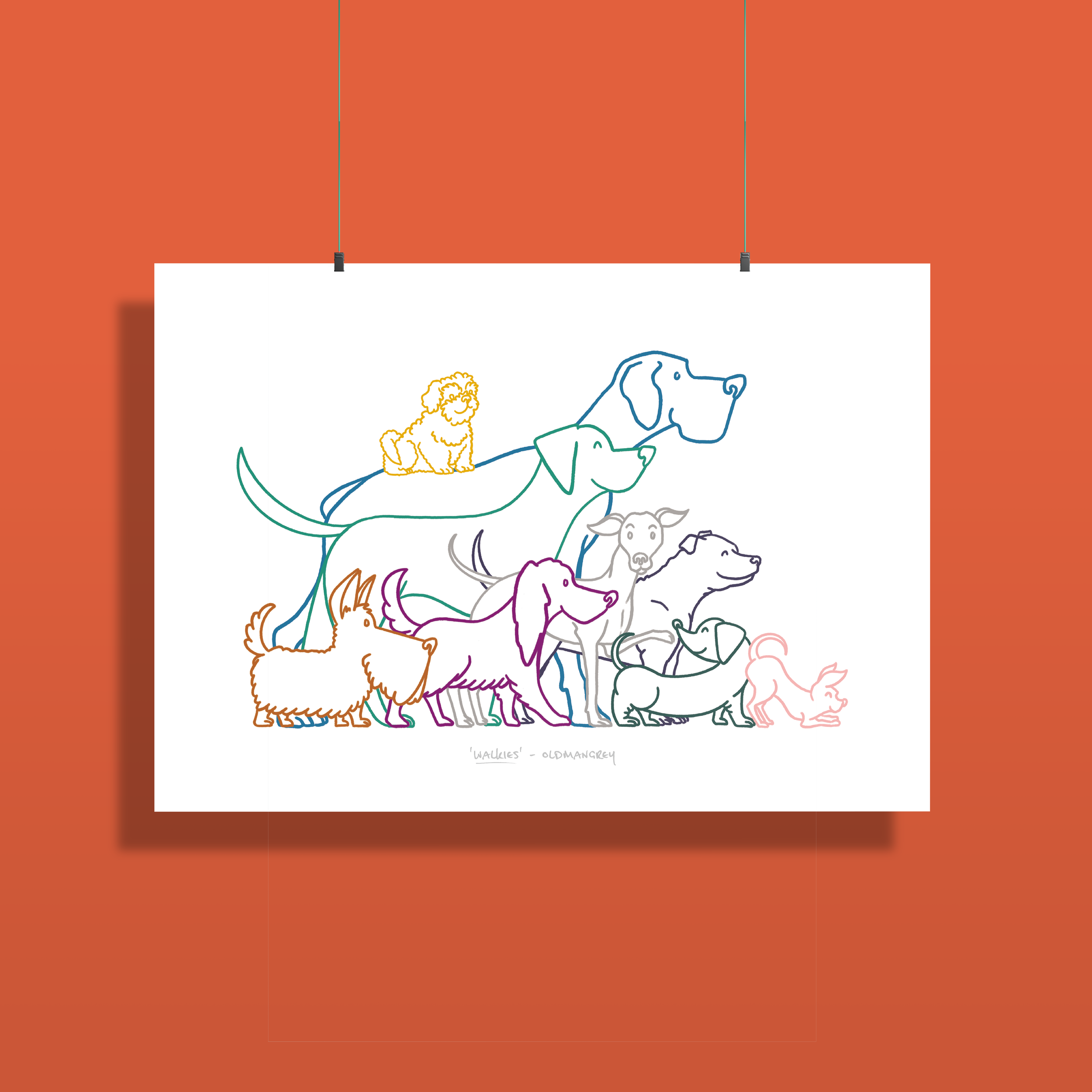 An A3 print set against a dark green backdrop, hanging by two thin strings clipped to the top edge. The print has a colourful digital illustration of 9 dogs all ready to go walkies!