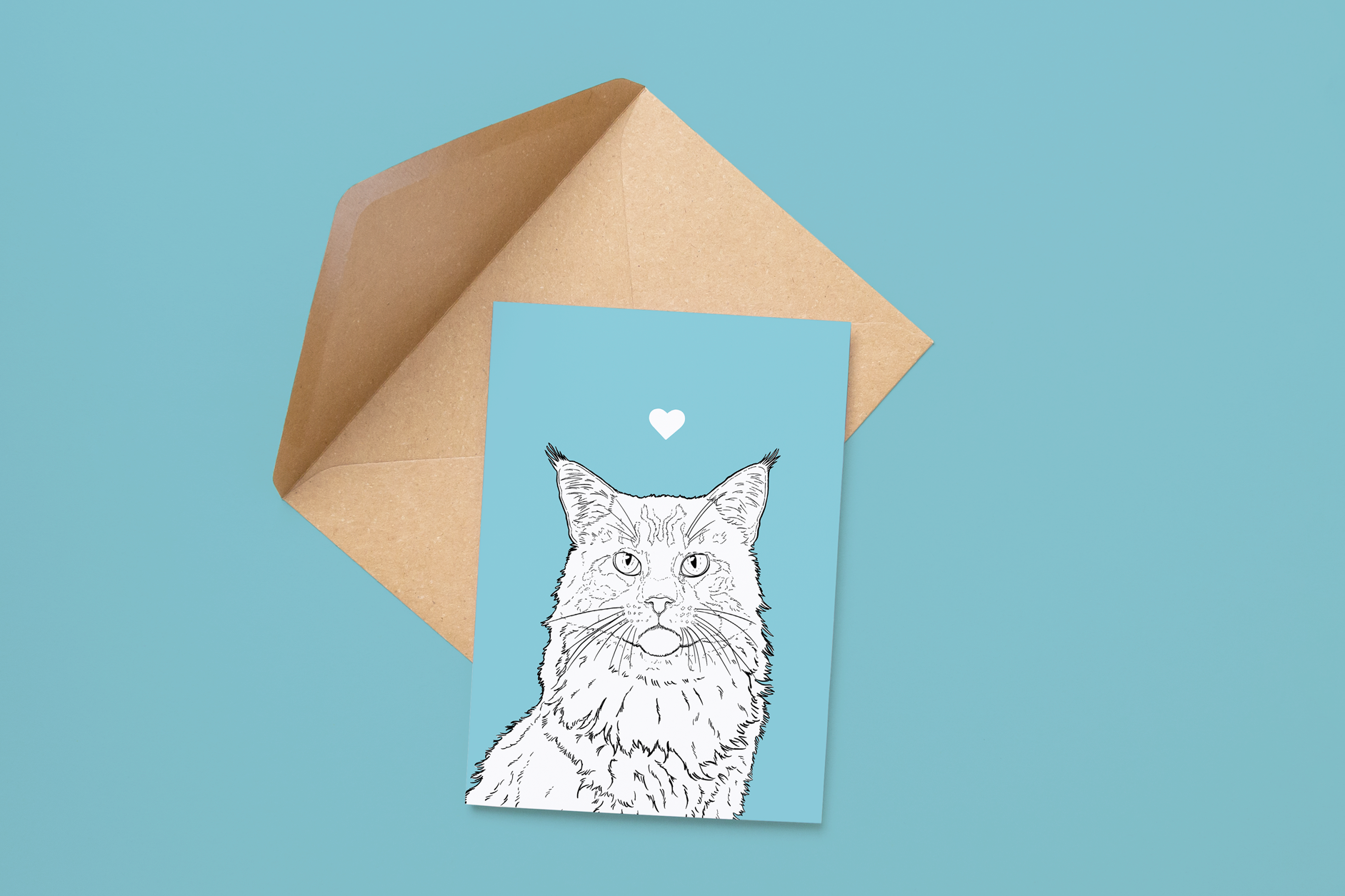 An A6 greetings card on a brown envelope. The card & image have a pale blue background, with a black & white digital illustration of the head & shoulders of a Maine Coon.