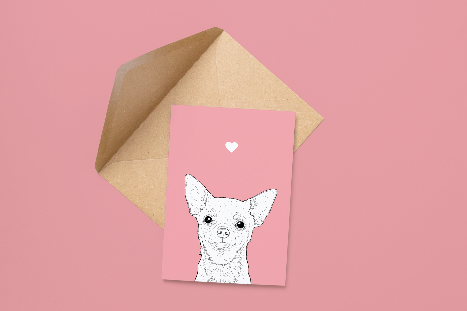 An A6 greetings card on a brown envelope. The card & image have a pink background, with a black & white digital illustration of the head & shoulders of a Chihuahua dog.