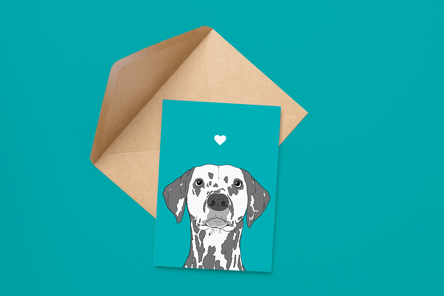 An A6 greetings card on a brown envelope. The card & image have a teal blue background, with a black & white digital illustration of the head & shoulders of a Dalmatian dog.