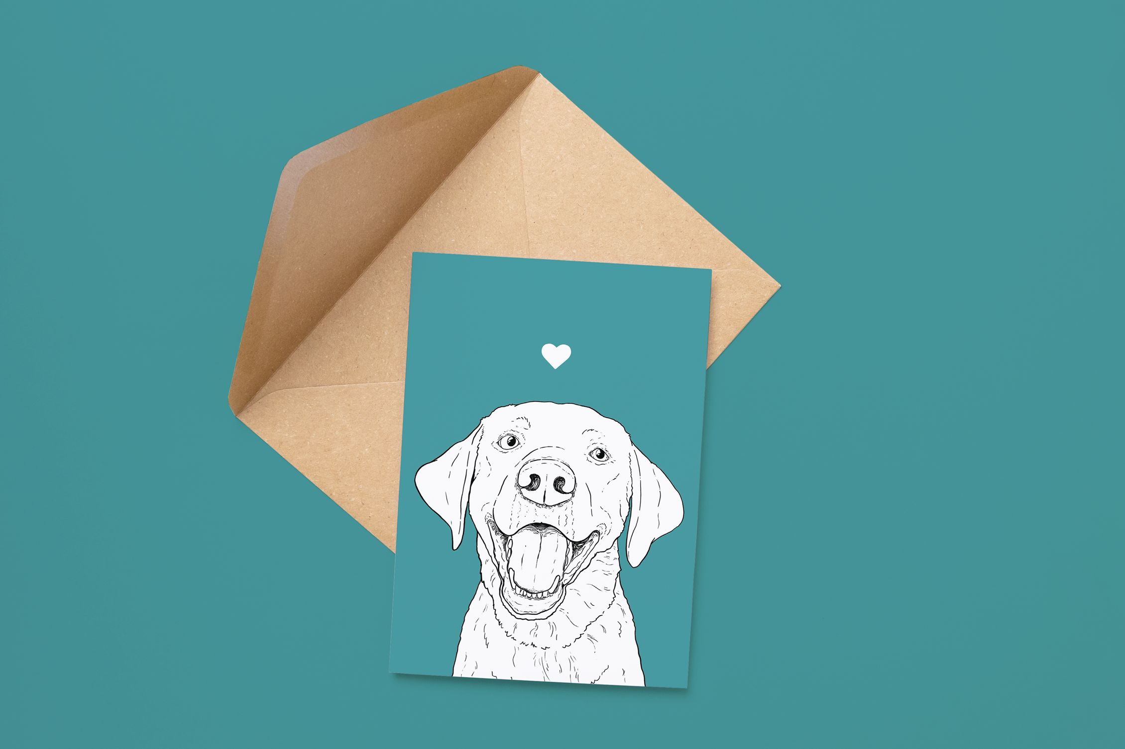 An A6 greetings card on a brown envelope. The card & image have a teal background, with a black & white digital illustration of the head & shoulders of a Labrador dog.