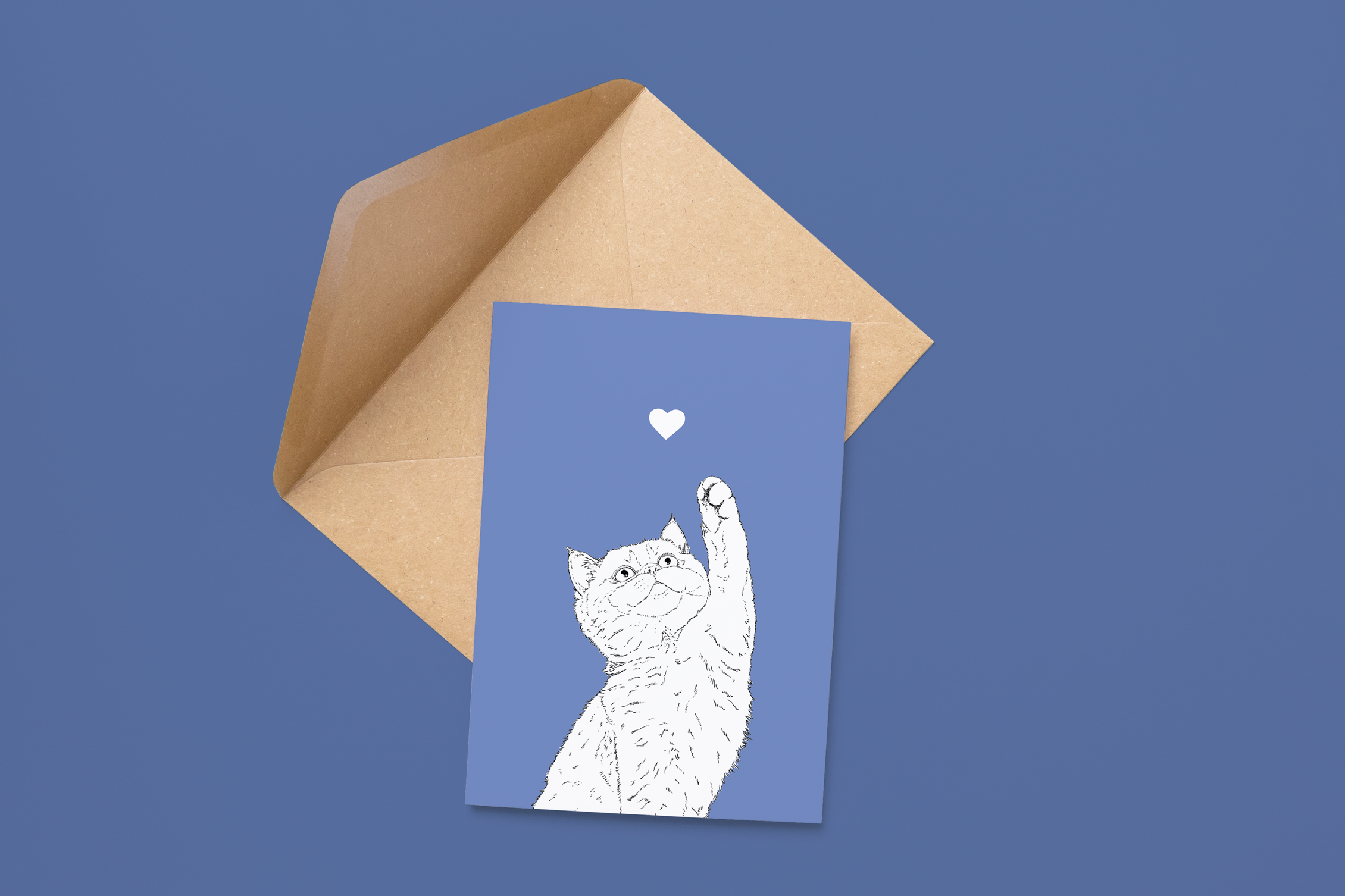 An A6 greetings card on a brown envelope. The card & image have a powder blue background, with a black & white digital illustration of the head & shoulders of a kitten.