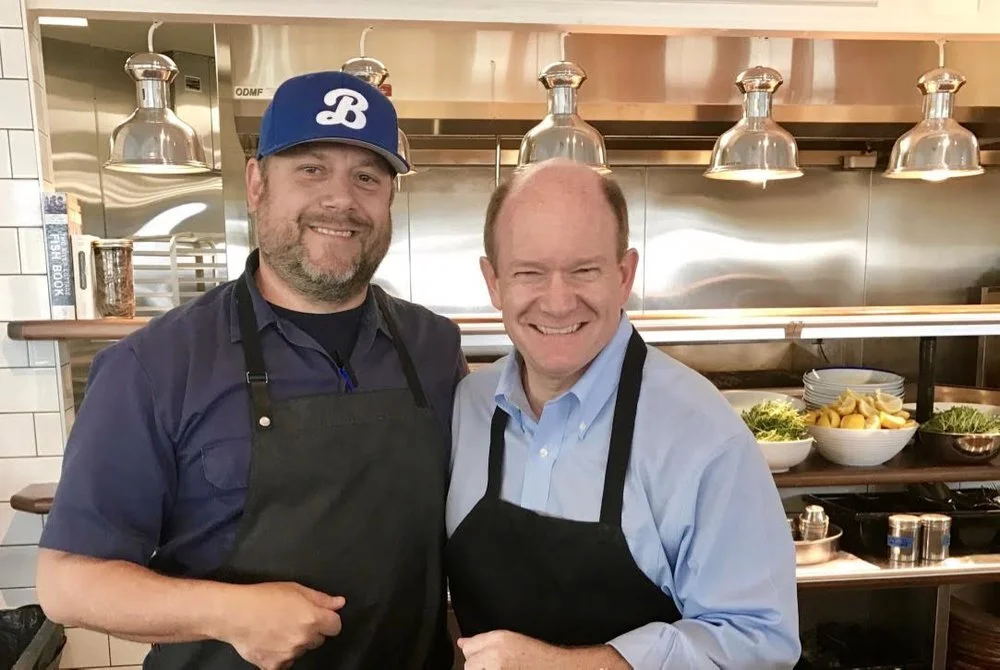 Sen. Chris Coons (right) recently visited the new Bluecoast Seafood Grill in Rehoboth Beach, one of SoDel Concepts’ 10 coastal restaurants. Corporate Chef Doug Ruley gave Sen. Coons a tour and the duo made tuna poke, a Hawaiian salad.
