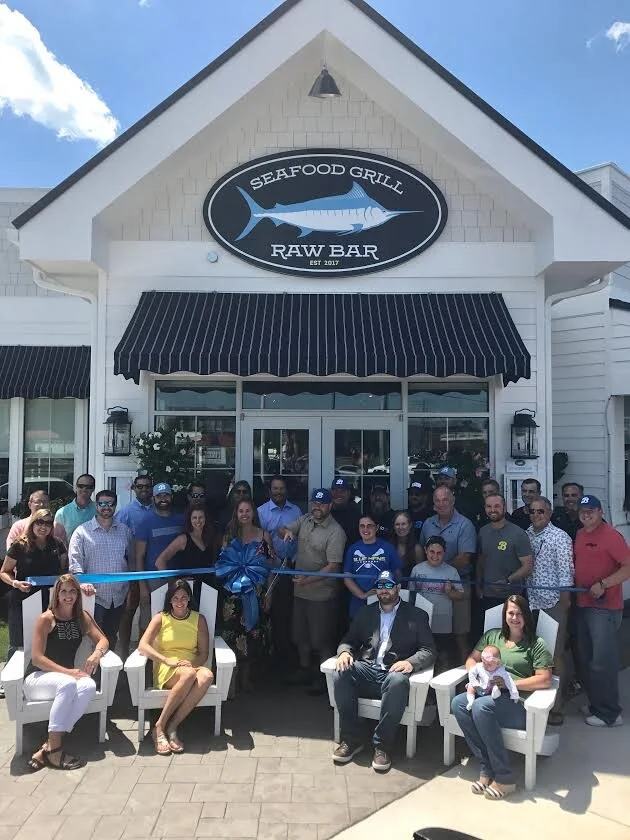 The Rehoboth Beach-Dewey Beach Chamber of Commerce welcomed Bluecoast Seafood Grill & Raw Bar to the resort community with a ribbon cutting June 26th.