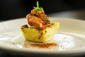For his dinner at the James Beard House, Doug Ruley has created the theme Coastal Summer Kitchen. One of the items at the reception will be a lobster knuckle with caviar atop Martin's Potato Toast with whipped scallion butter.