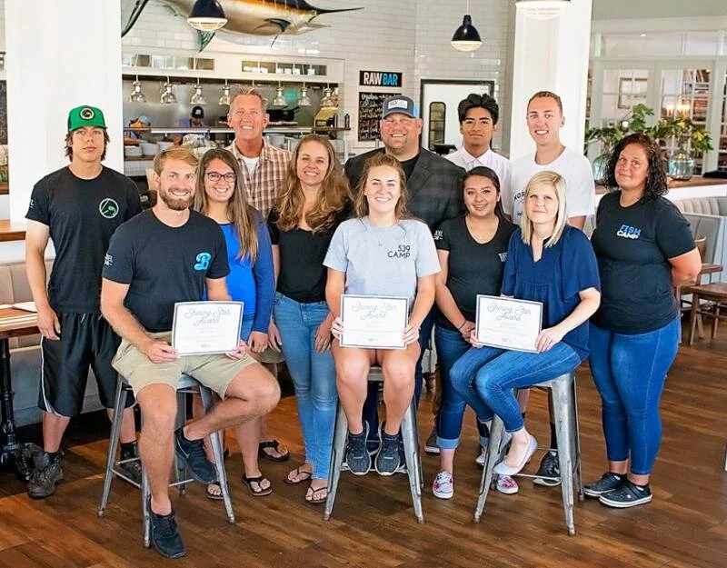 Thirteen SoDel Concepts employees recently received Shining Star Awards for their contributions to the hospitality company. The leadership team saluted the honorees at Bluecoast Seafood Grill + Raw Bar in Rehoboth Beach. Shown are (l-r) Rob Schmidke…