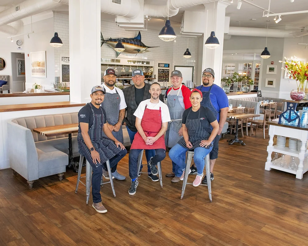 Chris Parks (center), a SoDel Concepts employee since 2014, was recently promoted to the position of corporate chef. Here, he is surrounded by SoDel Concepts teammates. From left to right: Chef Efrain Martinez; Maurice Catlett, corporate chef; Scott…