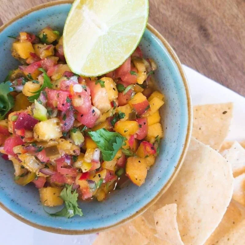August is Produce Month at SoDel Concepts restaurants, including Bluecoast Seafood Grill + Raw Bar in Rehoboth Beach, which has featured peach-and-heirloom-tomato pico de gallo.