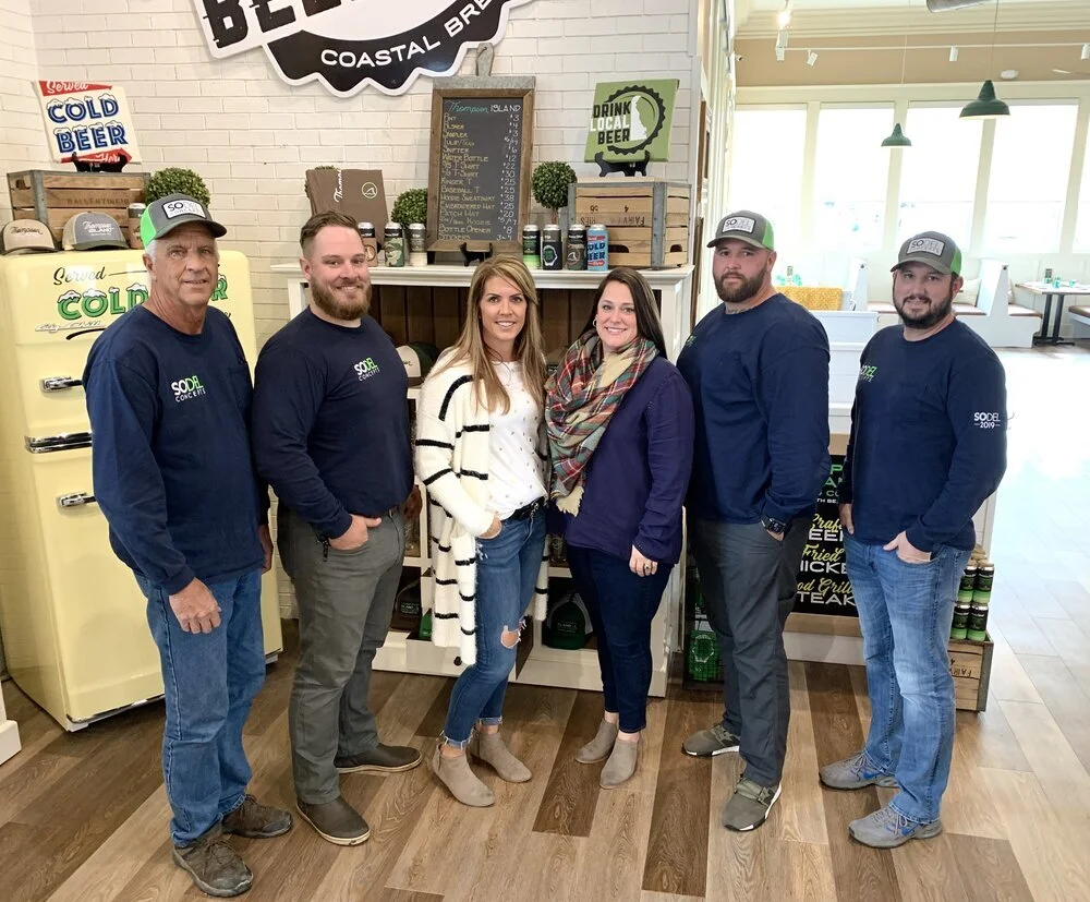 Designers Lisa Kammerer and Carey Graviet worked with SoDel Concepts’ in-house asset-management team to create the look for Thompson Island Brewing Co. From left: Bob Wolfgang, Phill Blush, Carey Graviet, Mike Spence, Chris Sockriter. [PHOTO PROVIDE…