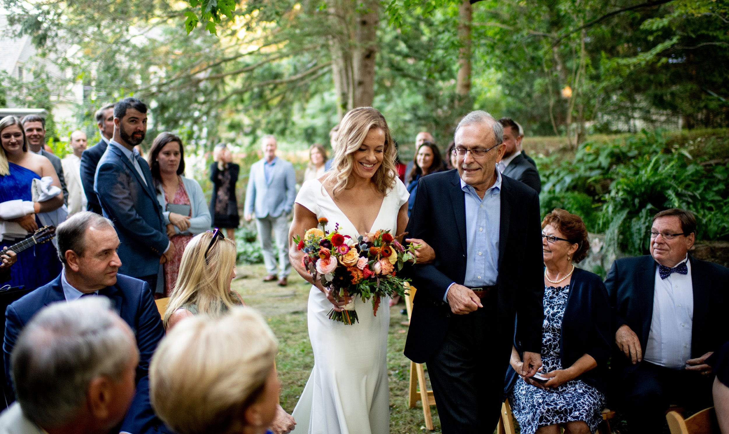 Bride-Escroted-by-dad-down-aisle-backyard-ceremony