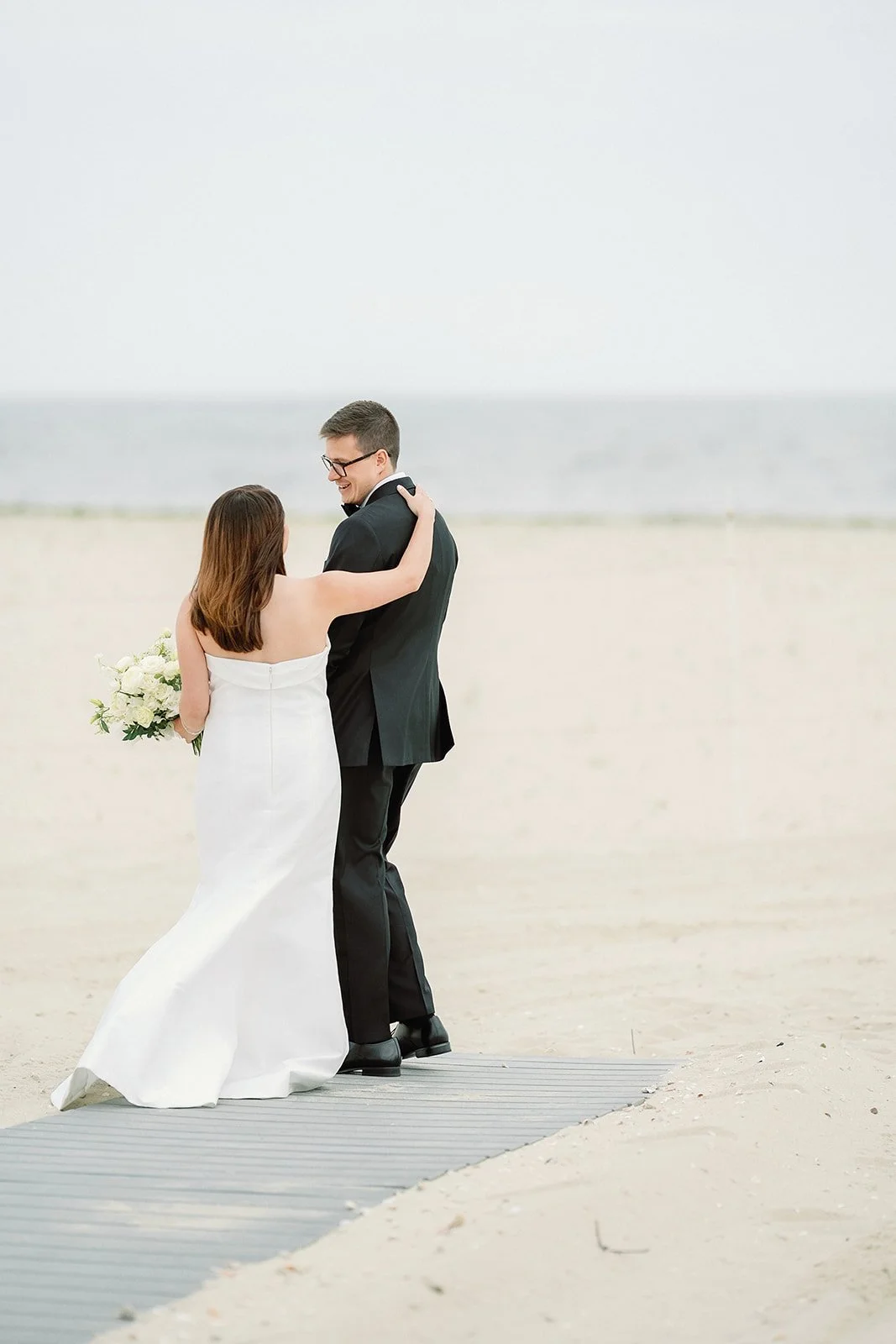 WychmereWedding_FirstLookonBeach_ErinDaviesConsultancy3.jpg