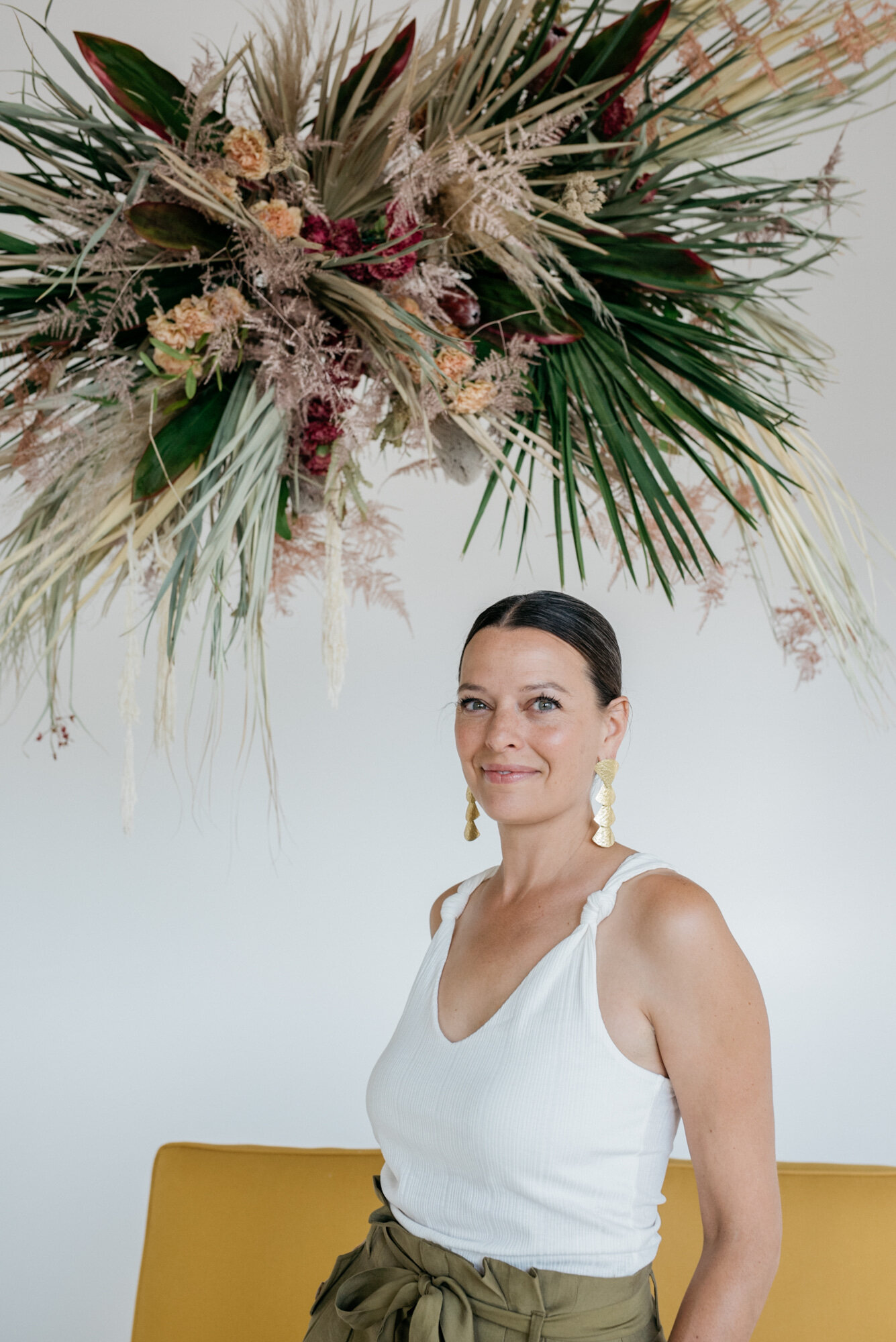 portrait in front of floral installation