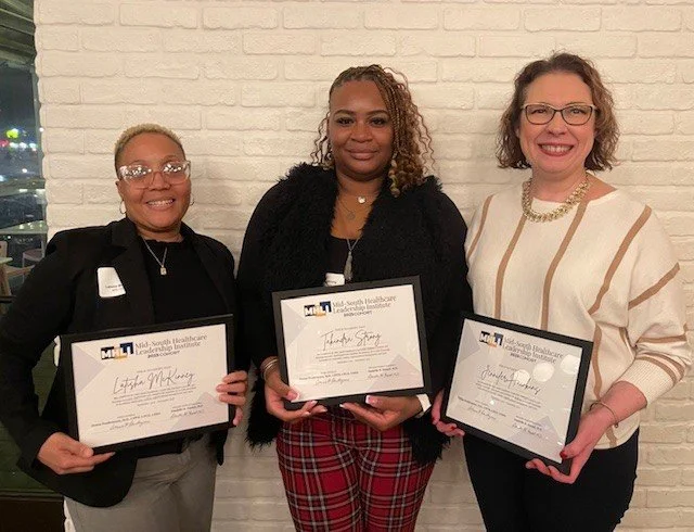 Latisha McKinney, Takindra Strong, and Jennifer Hawkins holding their Mid-South Healthcare Leadership Certificates
