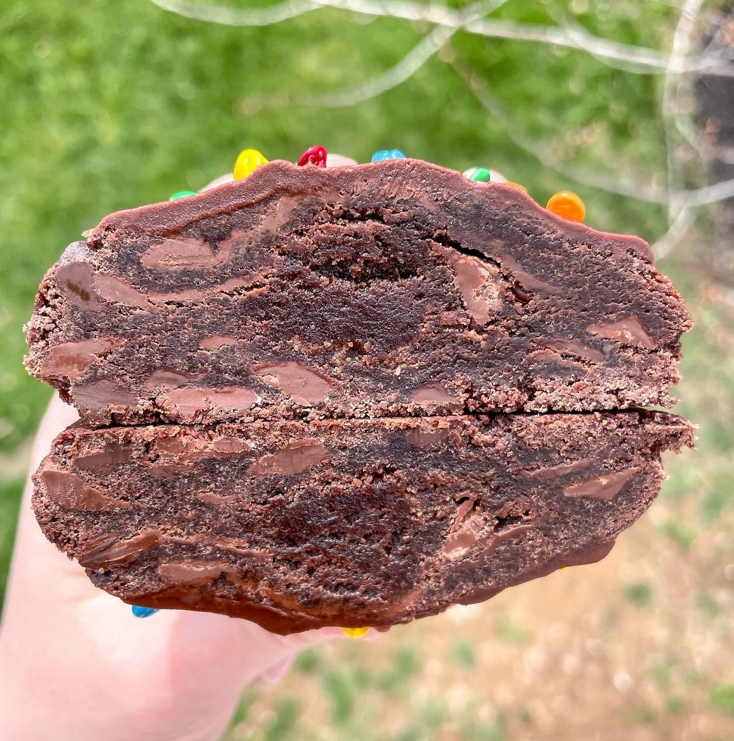 Cosmic Brownie cookies are coming back! 🪐 April orders will open TONIGHT at 8pm, so set your alarms! 

Our Cosmic Brownie cookie brings all the nostalgia of your favorite elementary school treat! This rich fudge cookie is stuffed with a decadent bro
