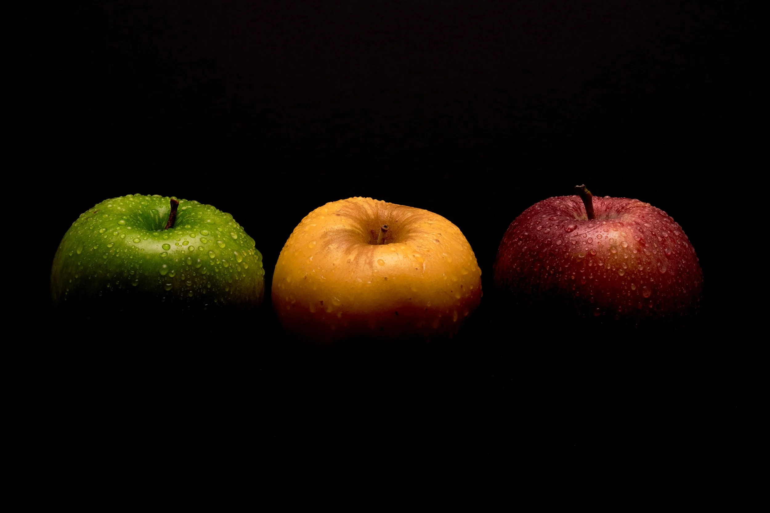 Wet Red Yellow Green Apples in Black .jpg