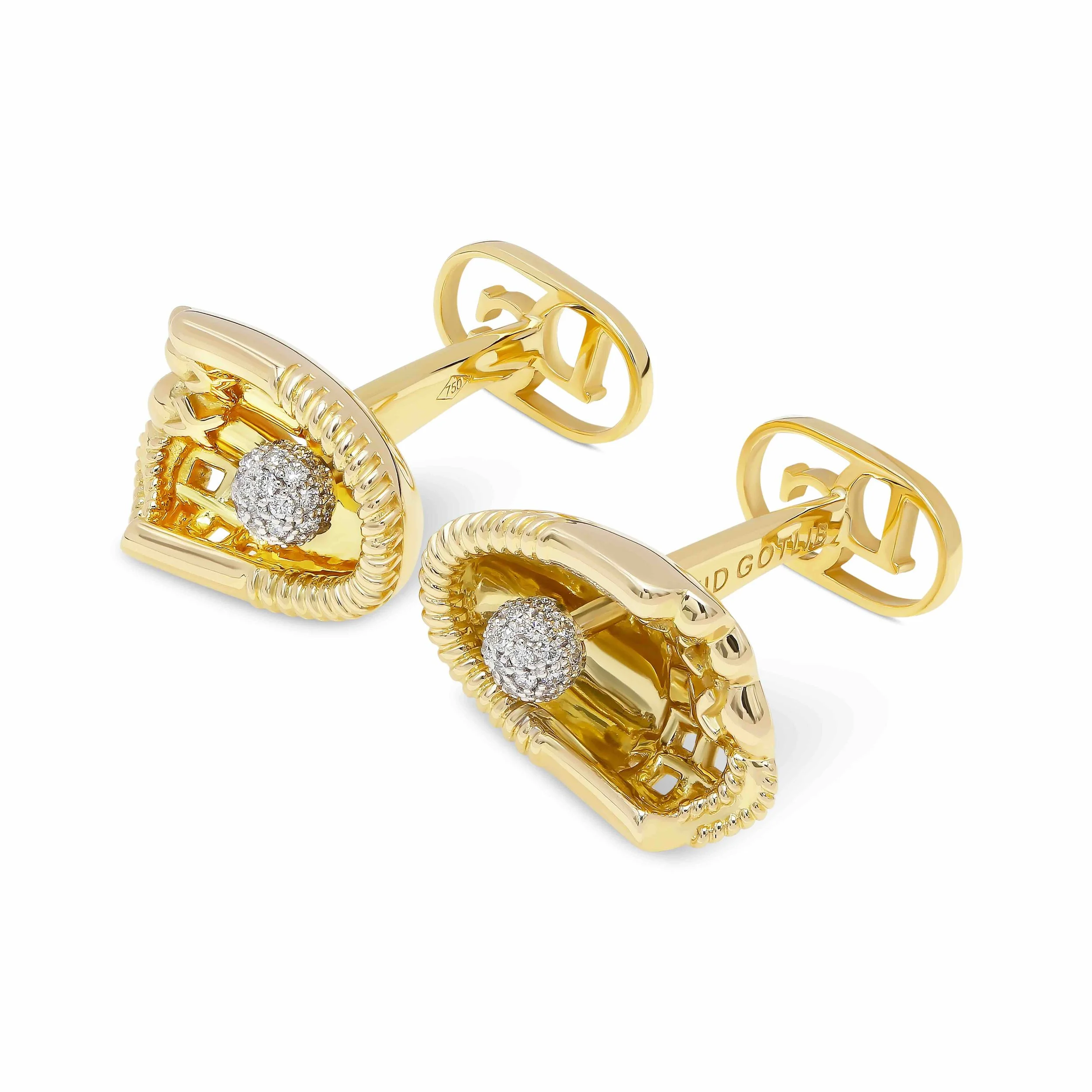 Close-up of gold jewelry rings with one featuring a cluster of small diamonds, set against a white background.