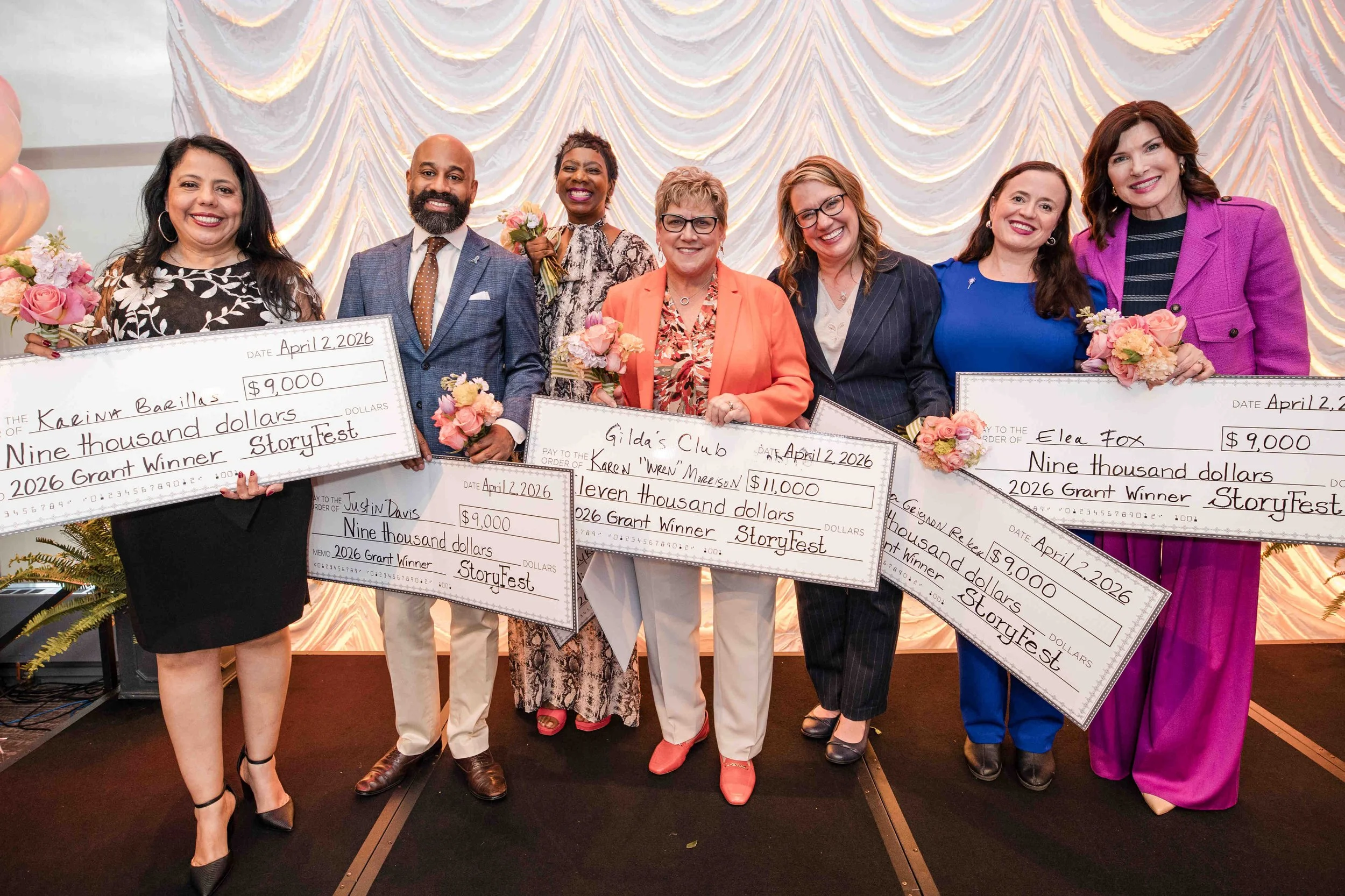 Group shot with checks.JPG