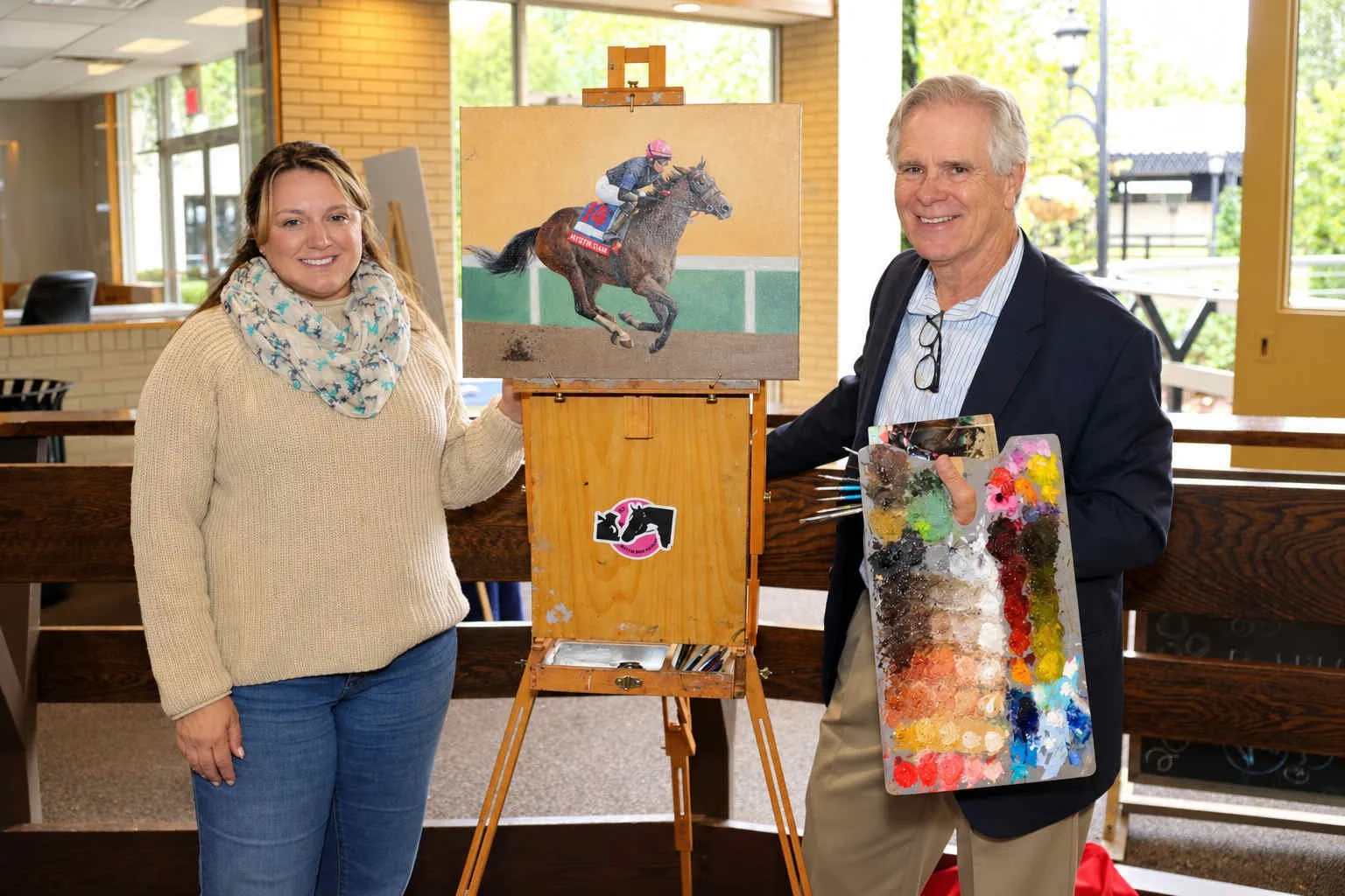 Artist and Jockey Celebrate Painted Racehorse.JPG
