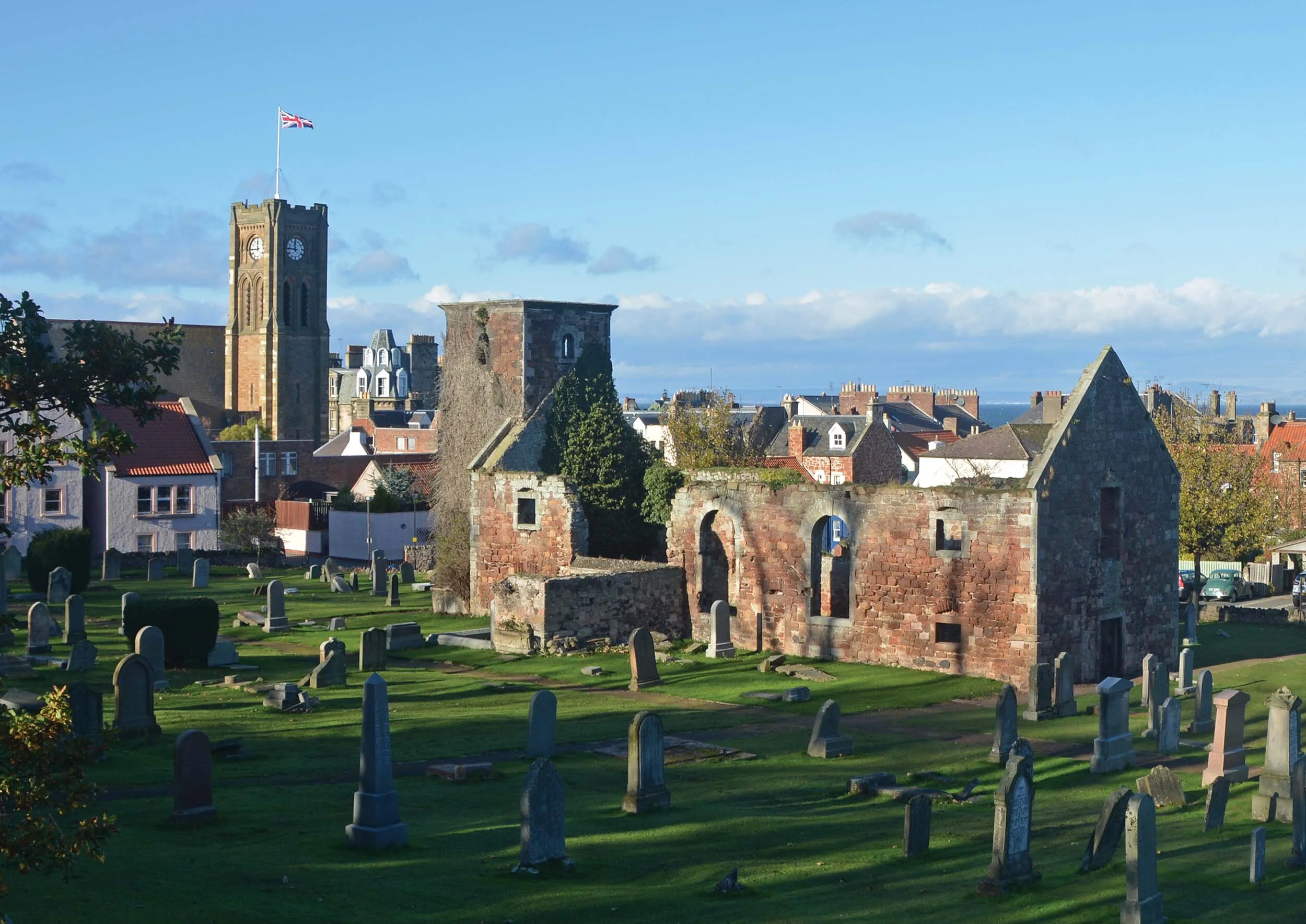 St Andrew's Kirk (1664, in ruins), and clock tower of the 'new' St Andrew Blackadder Church, replaced the church near the harbour
