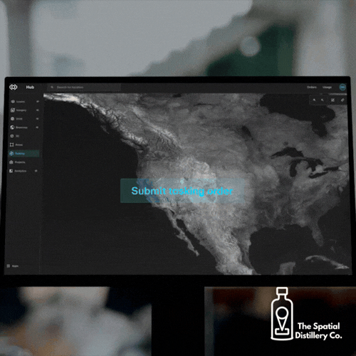 Computer screen displaying a map of North America with a blue button labeled 'Submit tasking order' and logo of The Spatial Distillery Co.