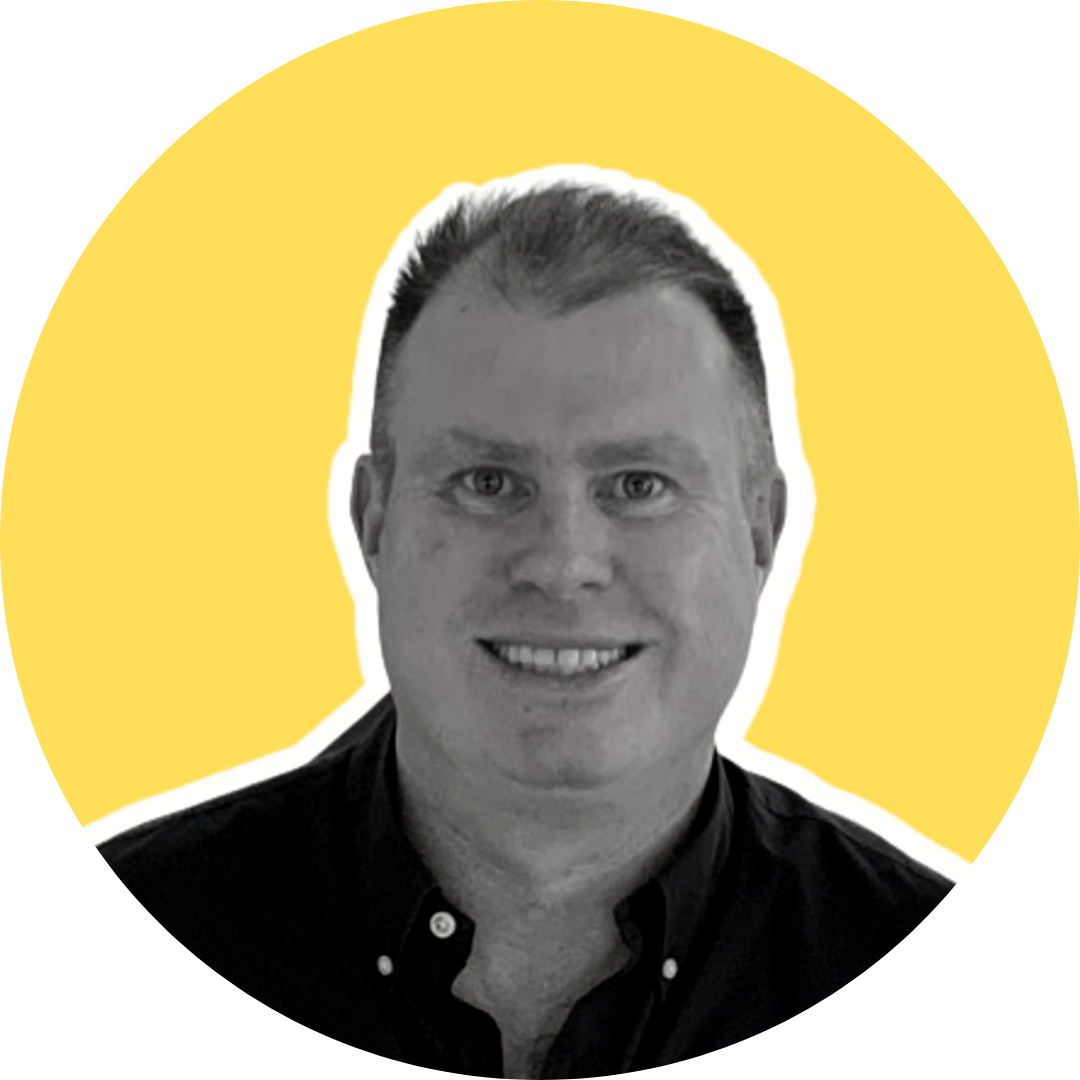 Black-and-white photo of a smiling man with short hair, outlined in white, against a yellow background with black geometric shapes.