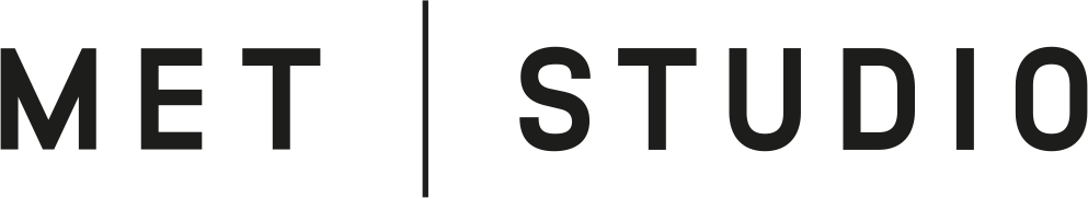 black and white logo with the words "MET" and "STUDIO".