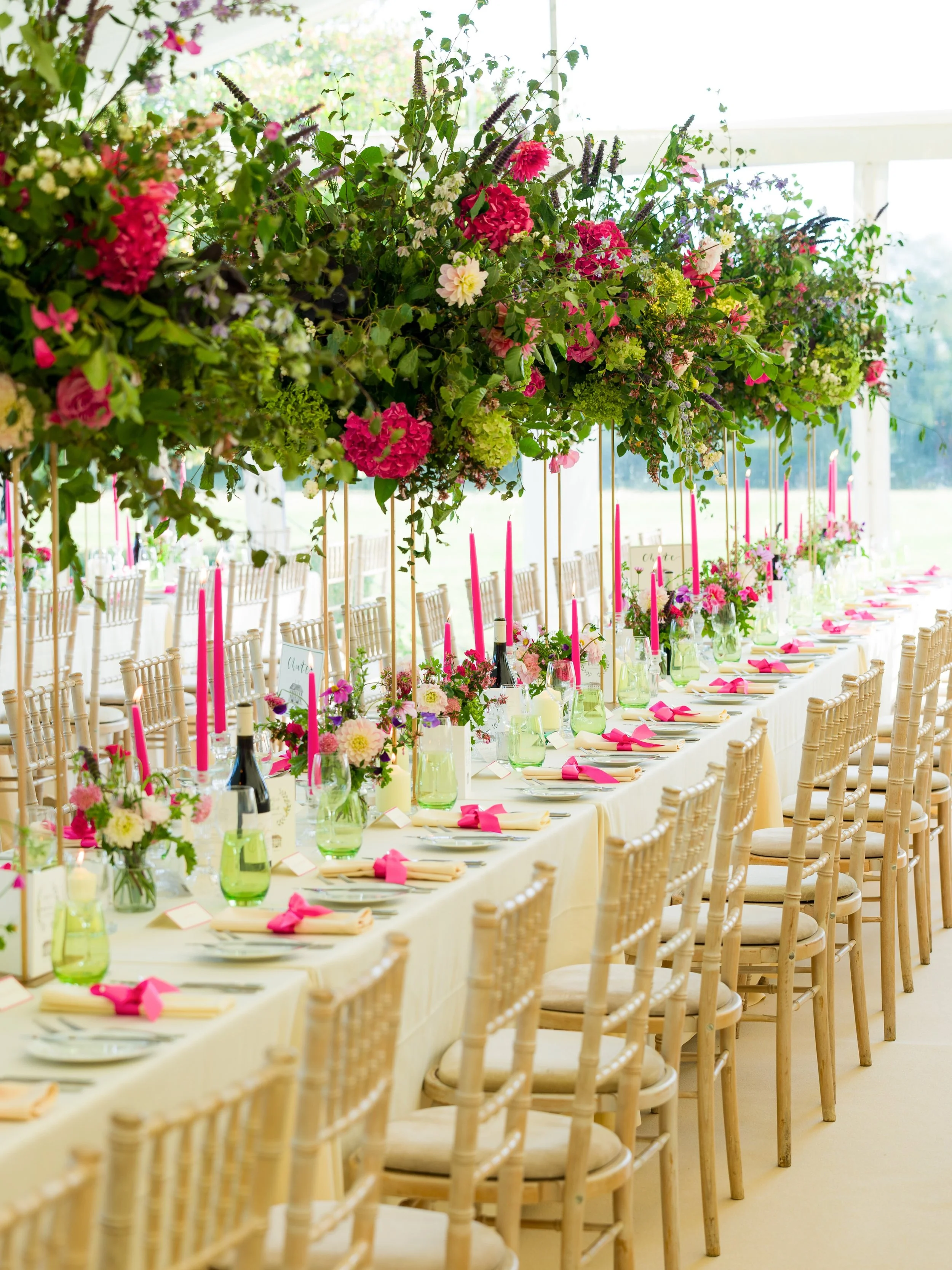 Pretty in pink 🌺

Pops of pink paired with green tones creating a romantic and timeless setting for S&amp;D&rsquo;s wedding. Stunning high table arrangements matched with bud vases. Beautiful illustrations for the table names of all their favourite 