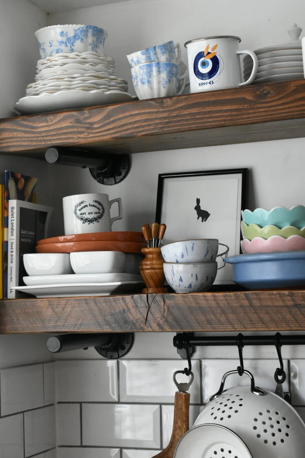 Crockery collected from travels on the kitchen shelves