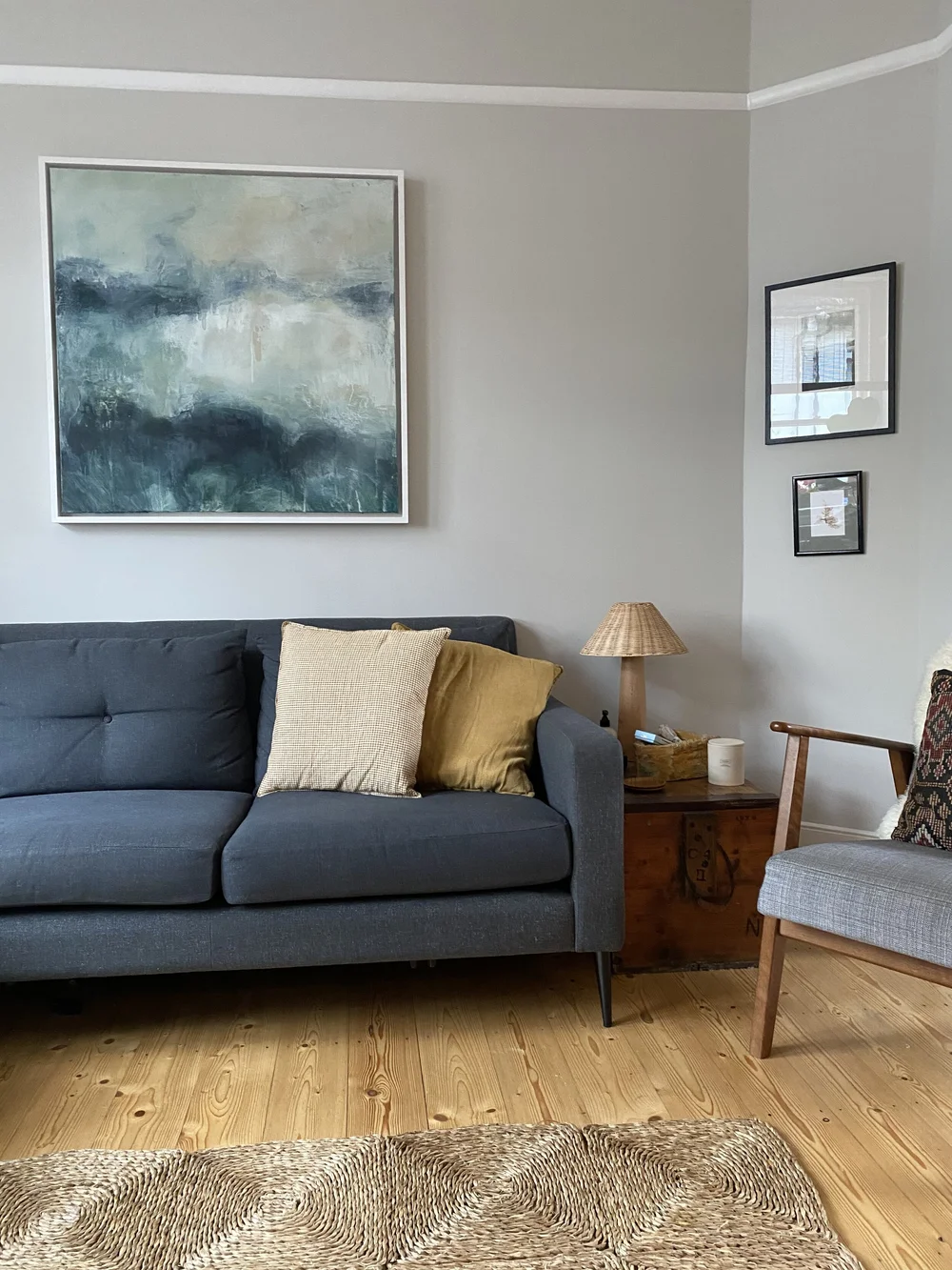 The mid-century style sofa is from Heal’s and the painting by Lily Rigby. The wooden trunk was found at Ardingly Antiques Market