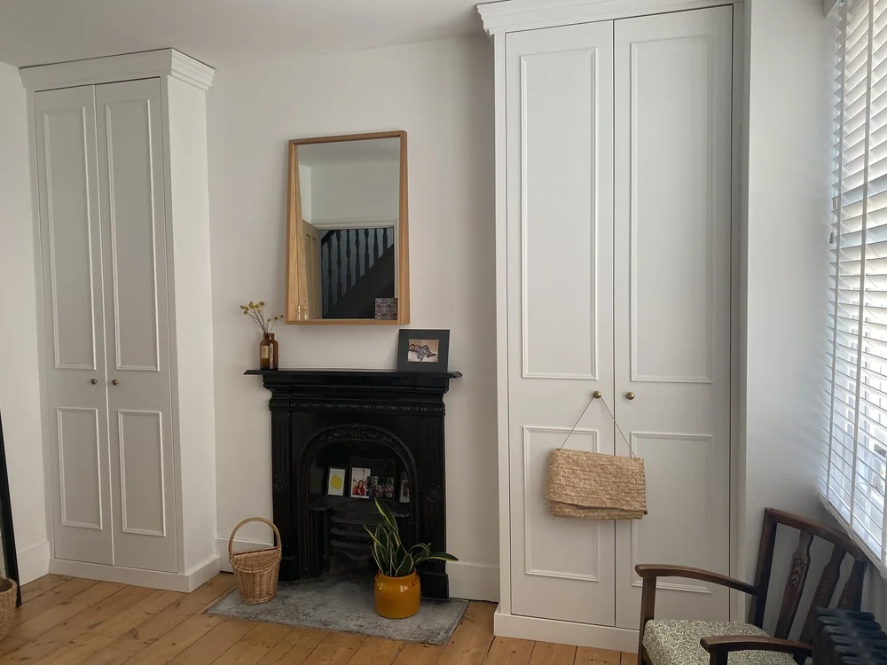 A joiner added the built-in wardrobes to the alcoves of the master bedroom