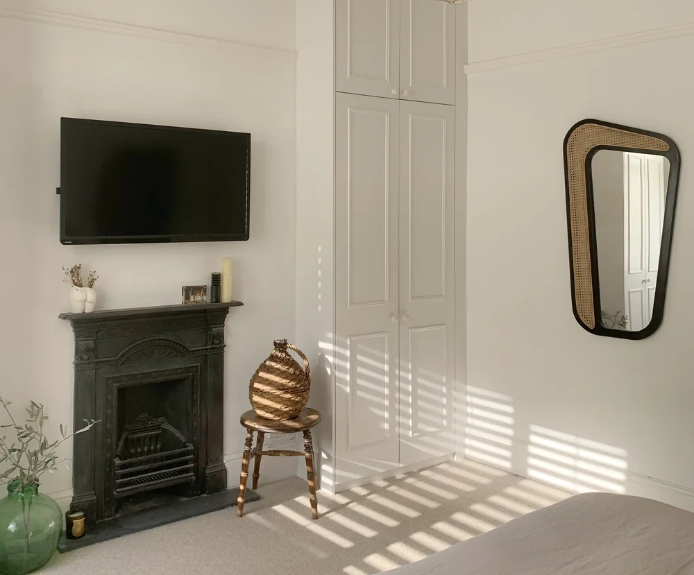 The mixed wood and rattan mirror in the bedroom was in Instagram find from  Heaps &amp; Woods