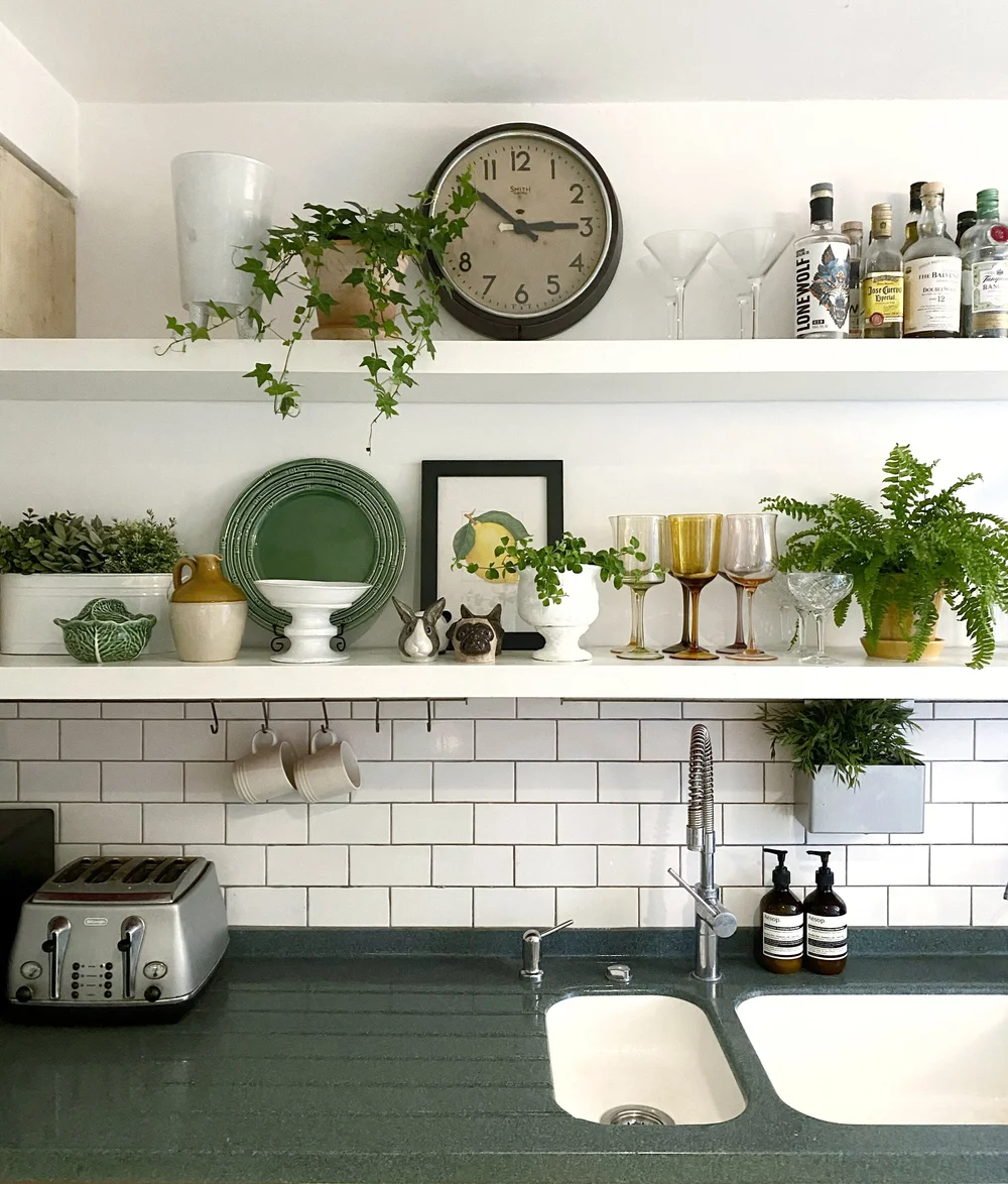Open shelving in the kitchen allows Sarah to display her glassware and Bordallo Pinheiro pottery