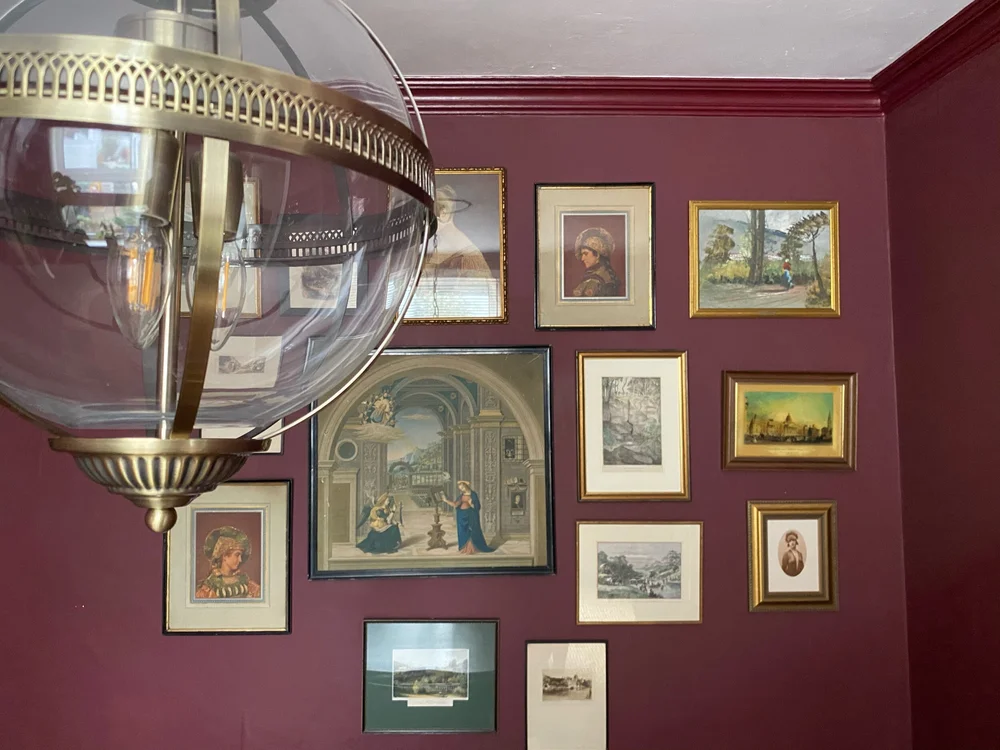 The gallery wall in the dining room