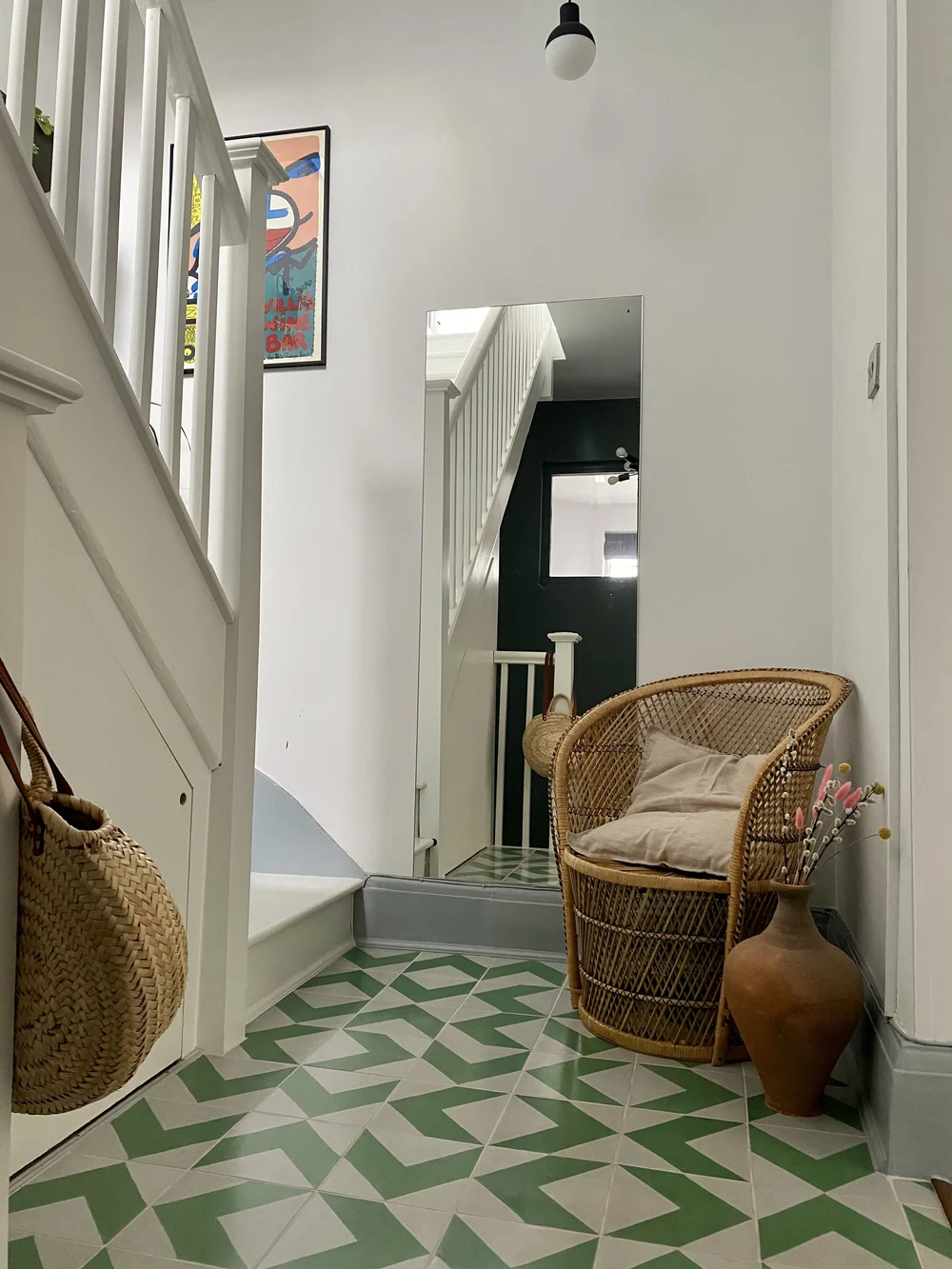 The hallway tiles are from Terrazzo Tiles. The wicker chair was an eBay find