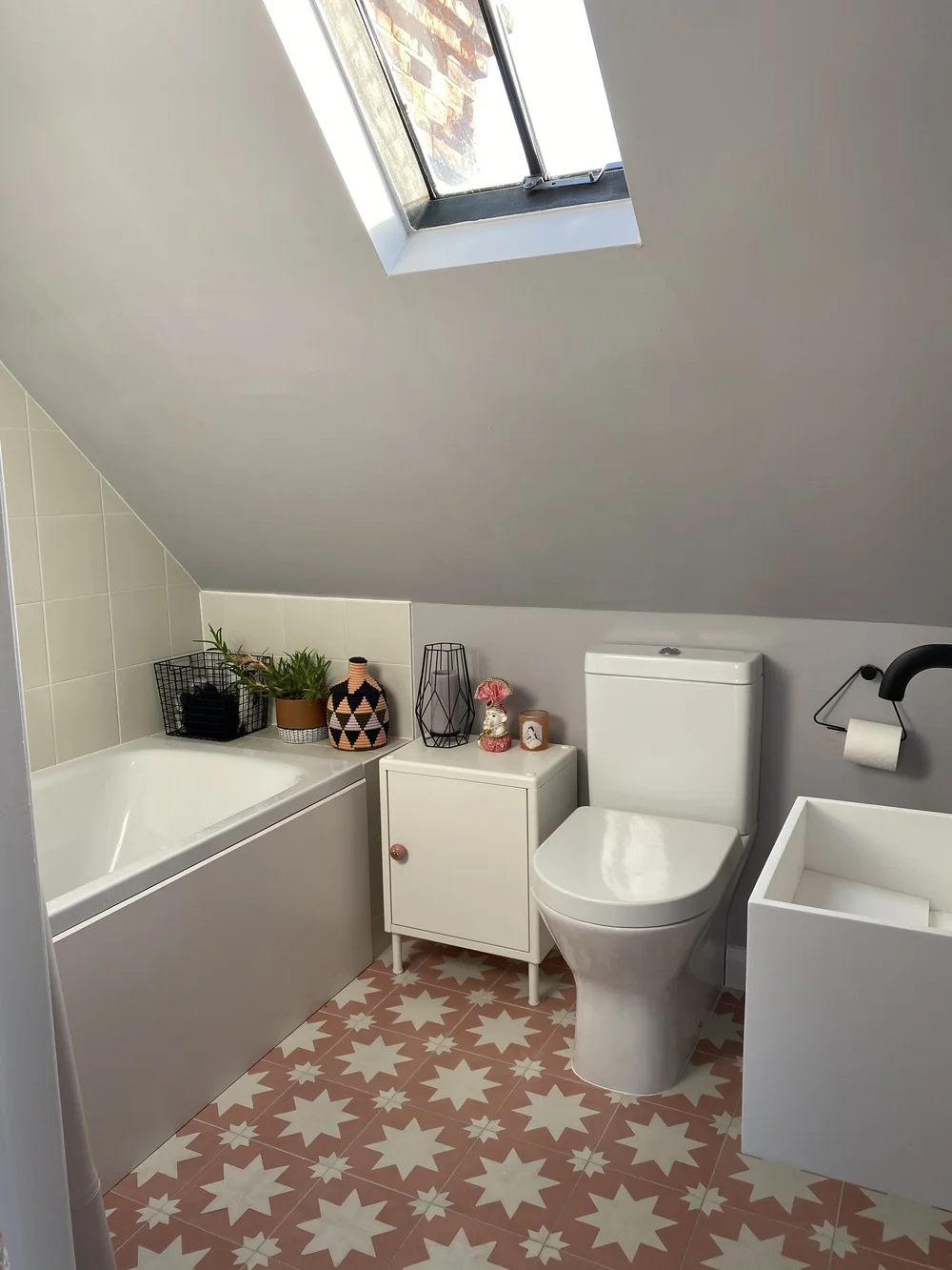 In the en-suite bathroom, the floor tiles are from Bert &amp; May