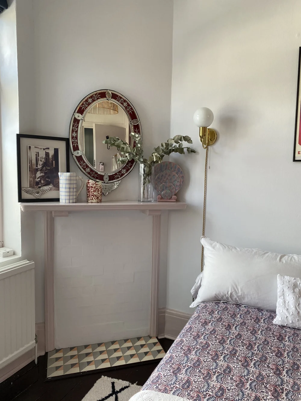 The hearth in the spare room features tiles from Bert &amp; May