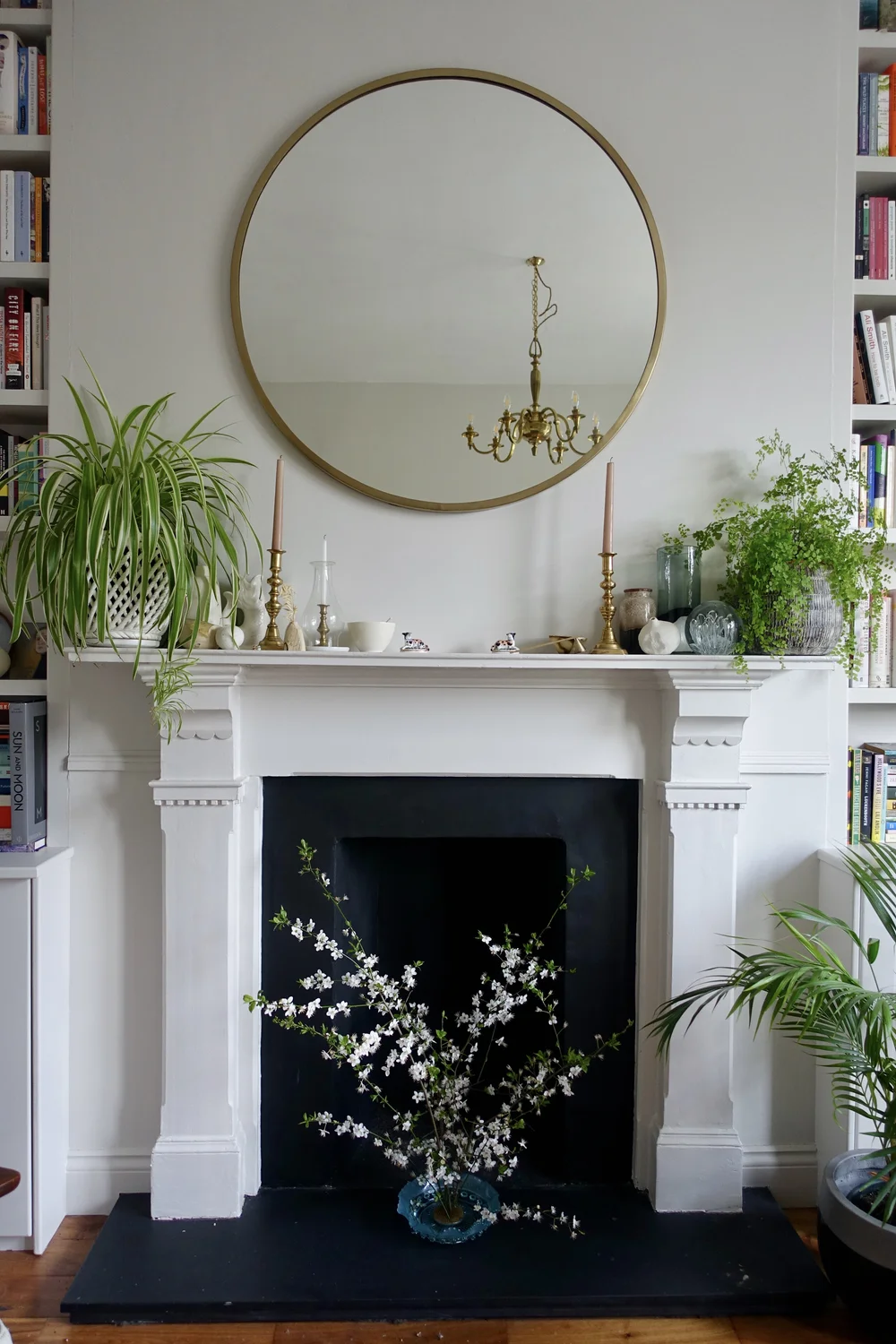The mantle mirror is from Maisons de Monde; the light fitting was sourced by Pato