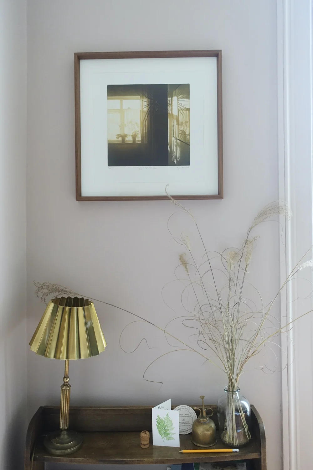 The brass light shade is by Matilda Goad